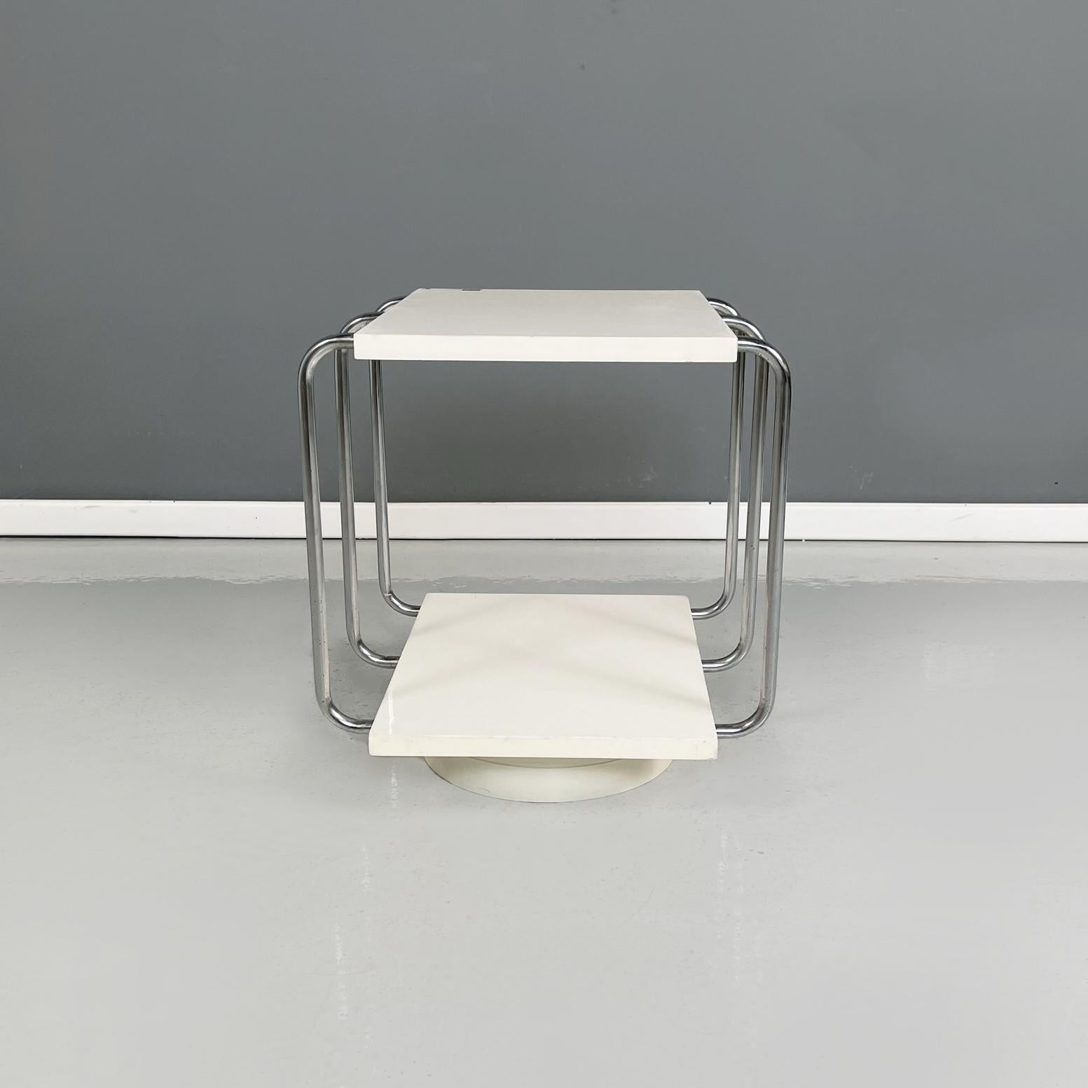 Italian modern Double-shelf coffee table in white painted wood and metal, 1980s
Rectangular double-shelf coffee table in white painted wood. The structure is in tubular metal. Round base in white painted wood.
1980s
Vintage condition, it show