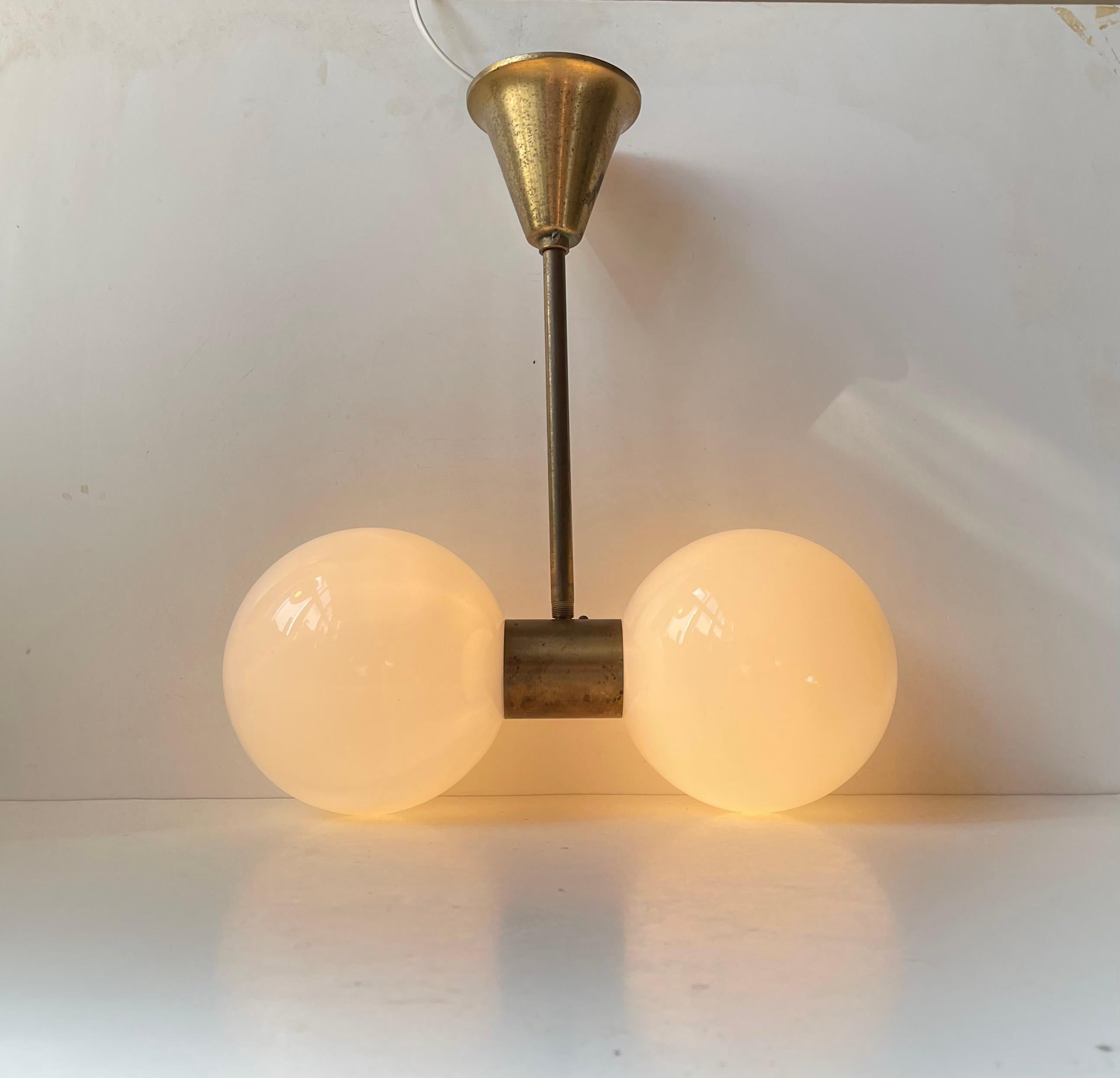This particular flush mount / suspended ceiling lamp came from a Hotel in Verona Italy. It has a lot in common with the usual Sputnik period lightning but we suspect this one was ordered as a bespoke piece for a specific room, a bar or a foyer. It