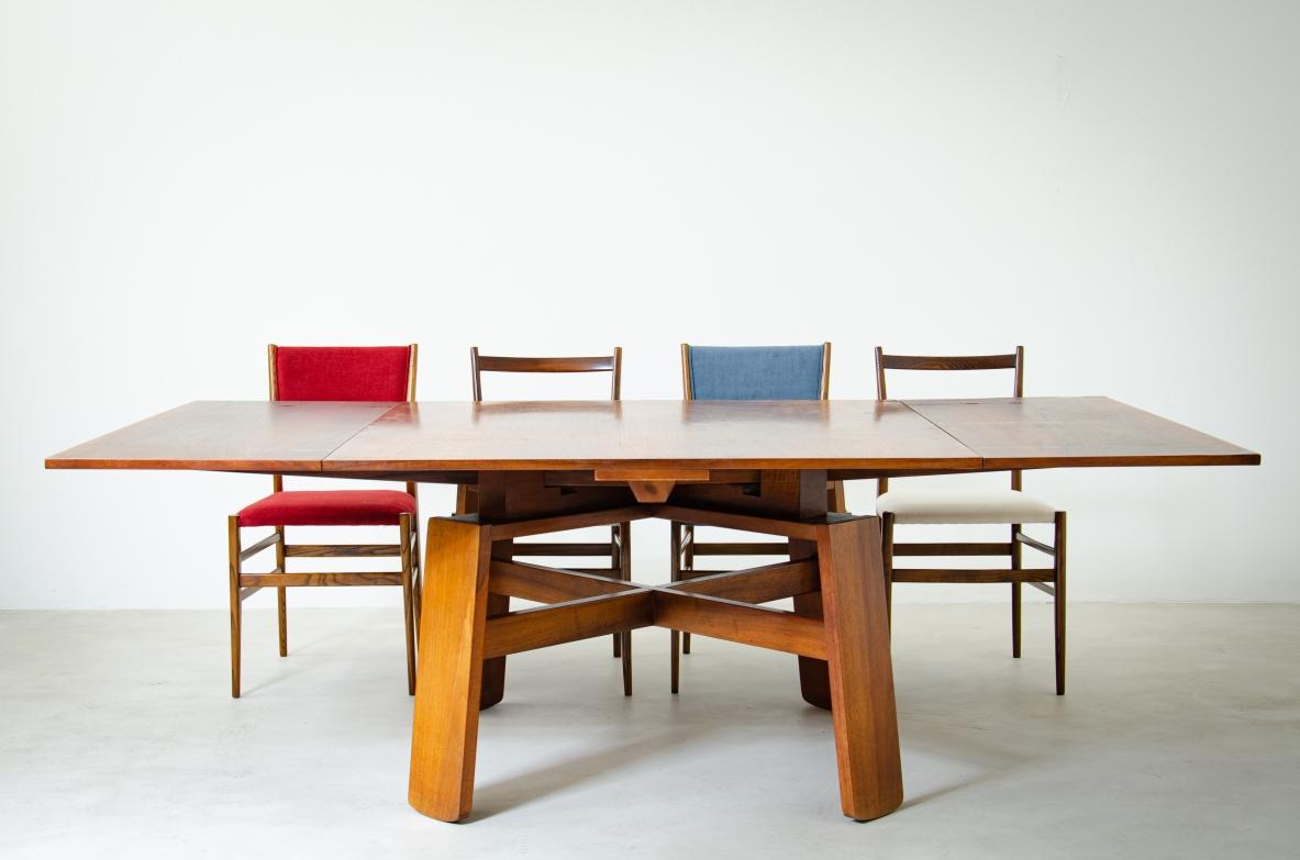 COD-2087
Italian Modern Extension Dining Table in walnut designed by Silvio Coppola.

The square top with extension leaves over a base with X-form stretcher fully restored superb condition- signed.

Manufactured by Bernini Italia,