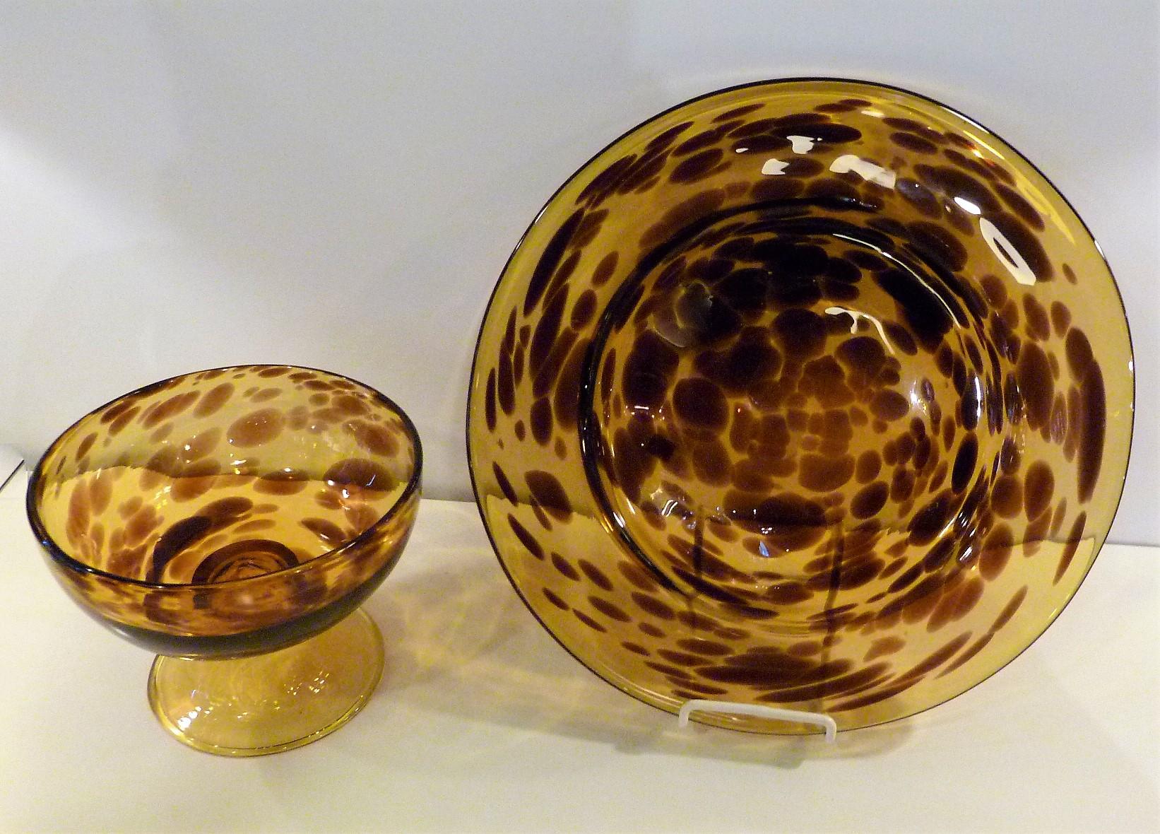 Italian Mid-Century Modern faux tortoiseshell footed blown glass bowl and large charger from the late 1960s-early 1970s.
The Tartaruga (tortoise) pattern in the footed bowl and charger have beautiful deep Topaz and Amber coloring resembling the