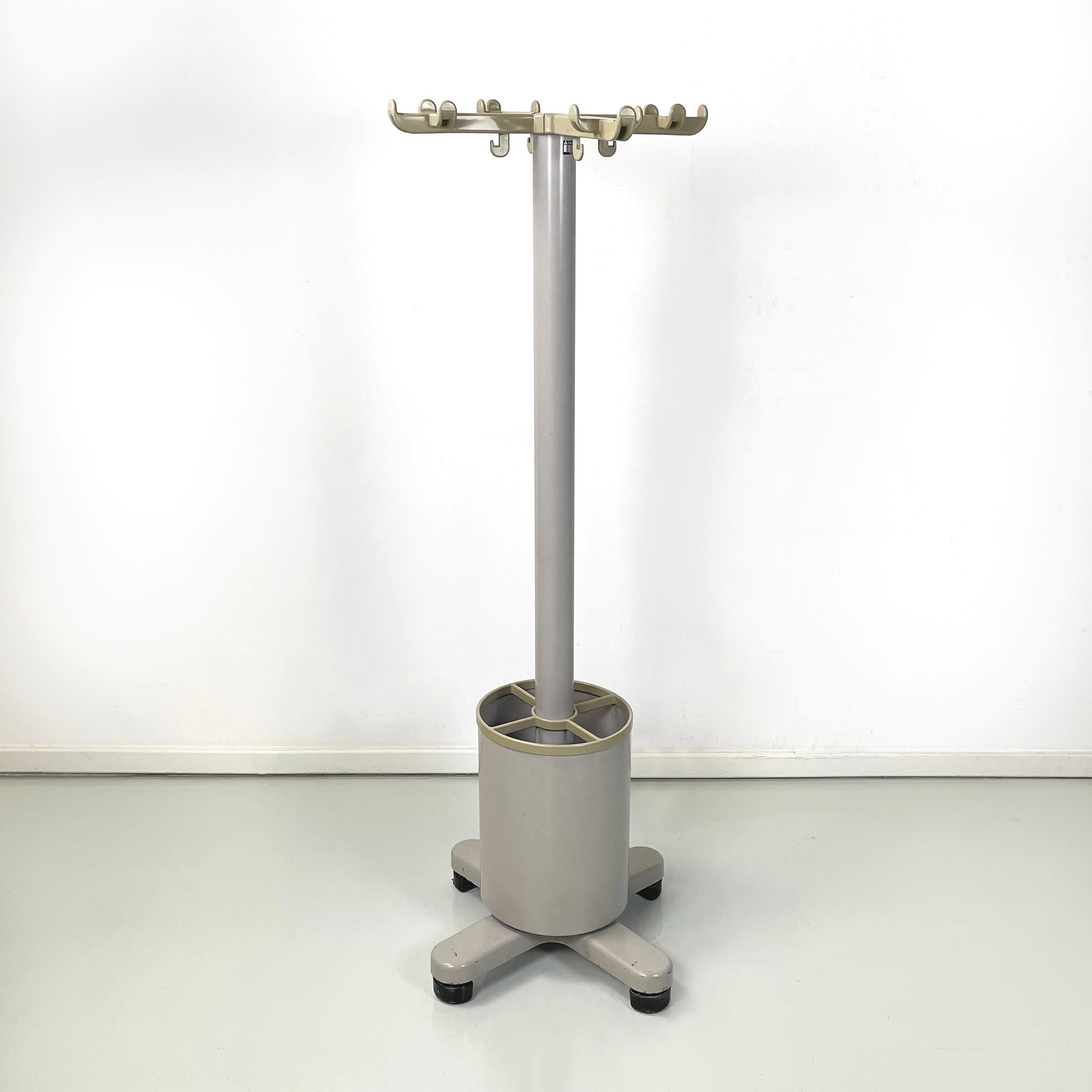 Italian modern floor coat hanger mod. Synthesis 45 with umbrella stand by Ettore Sottsass, 1990s
Floor coat hanger mod. Synthesis 45 with round base umbrella stand. In the upper part it has 4 arms with 4 hooks each, in beige plastic. The central