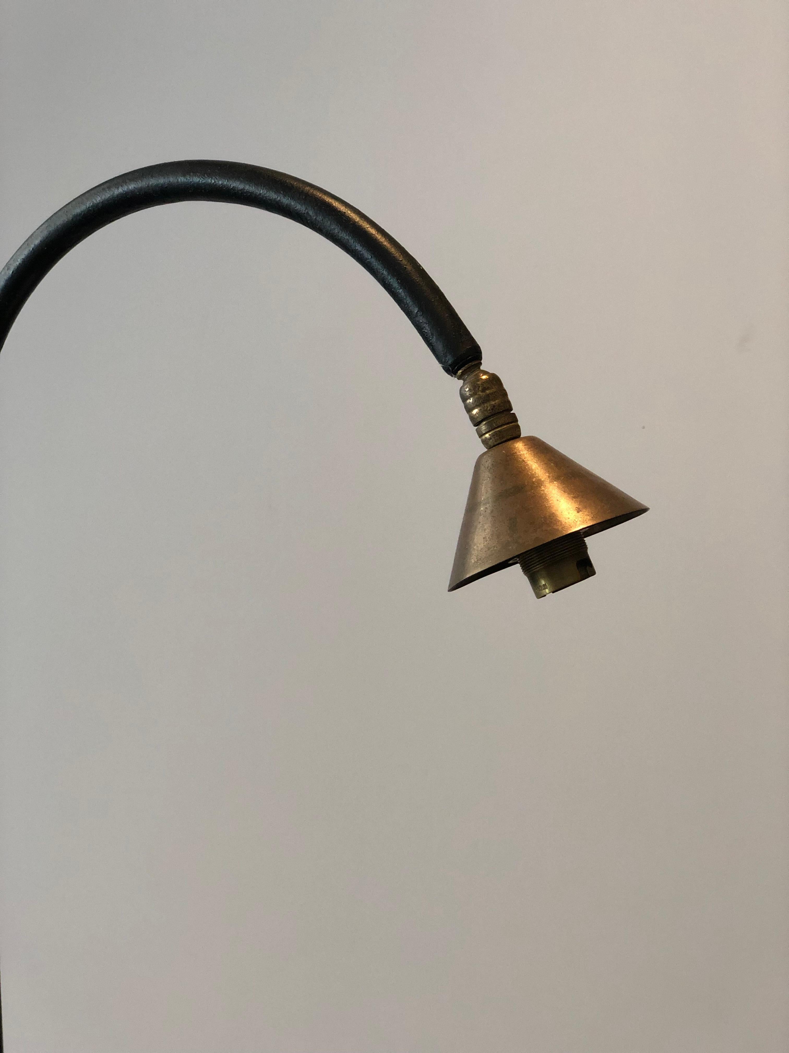 Italian modern floor lamp with brass shroud and blackened patinated steel base, circa 1950s.

 