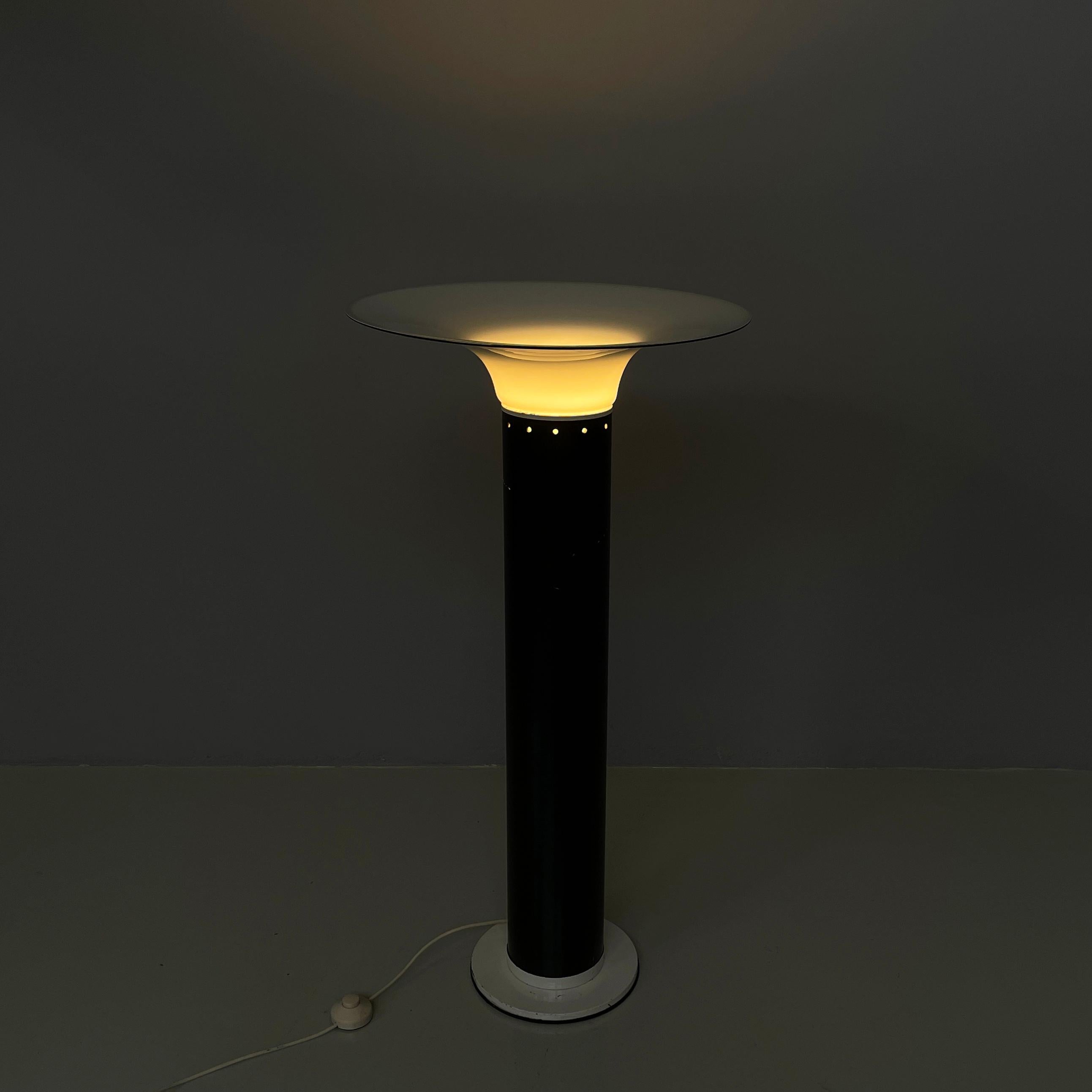 Italian modern Floor lamp in opaline glass metal plastic by Gino Vistosi, 1970s
Floor lamp with round opaline and black profile glass diffuser. The structure has a round section in black painted plastic with white painted metal profiles. Round base