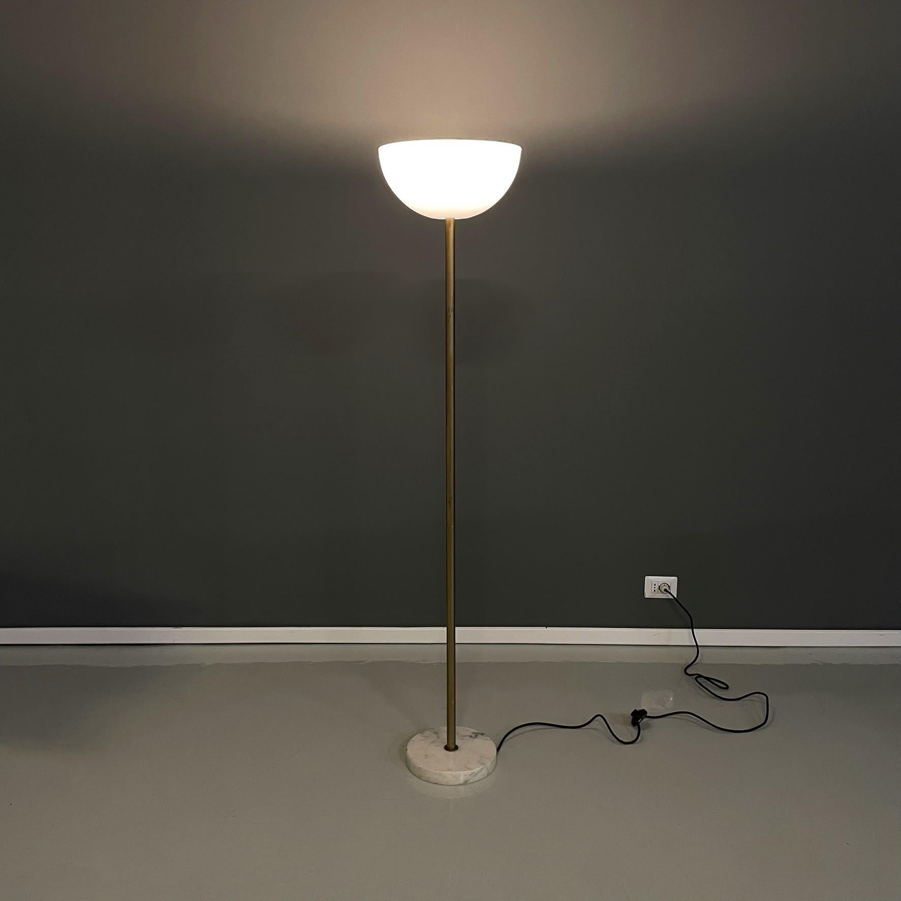 Italian modern Floor lamp in opaline plexiglass, marble and golden metal, 1970s
Floor lamp with round base in light marble. The hemisphere diffuser is in opal plexiglass. The central structure is composed of a metal stem with a golden finish.
It