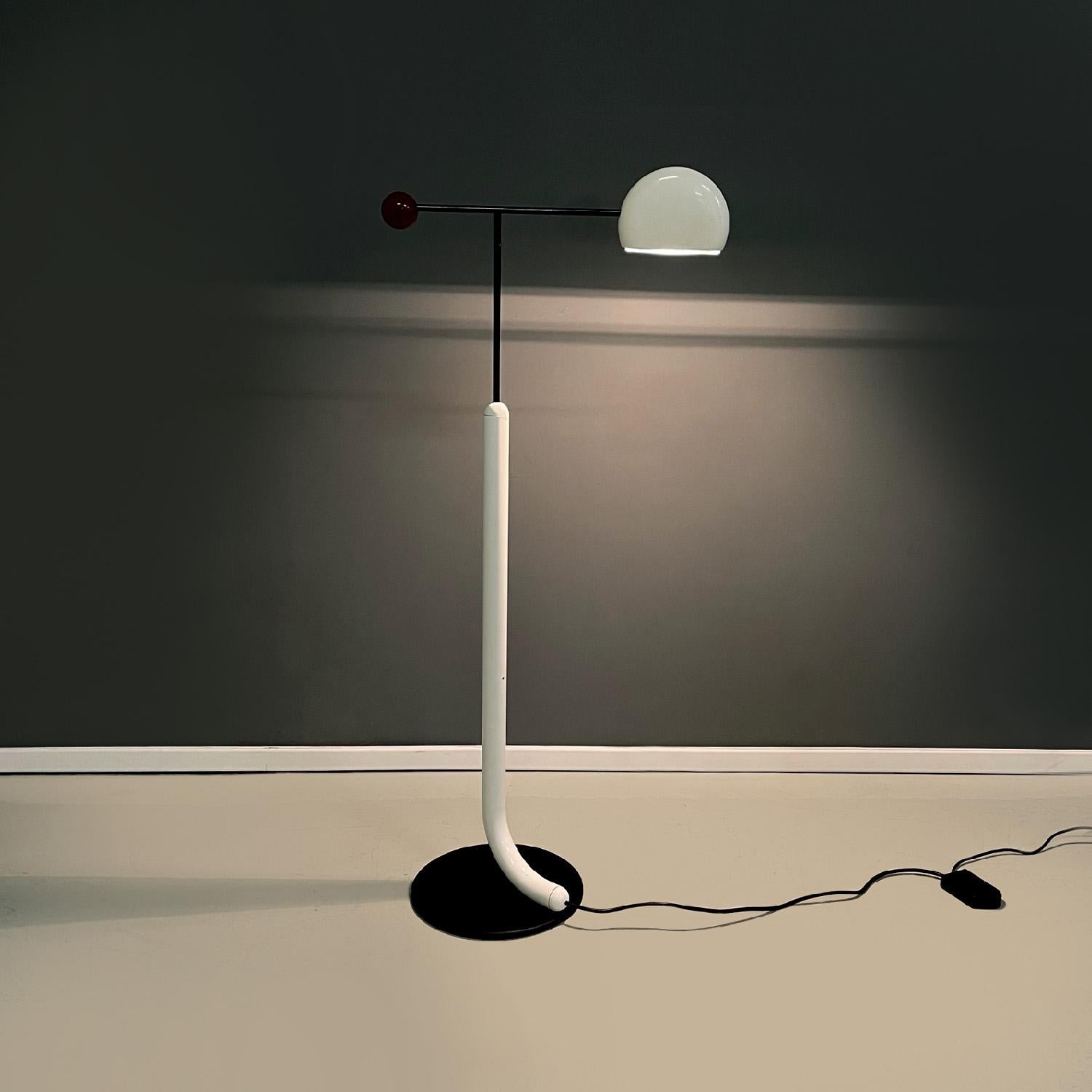 Italian modern floor lamp Tomo by Toshiyuki Kita for Luci, 1980s
Floor lamp mod. Tomo with a round base. The structure is made of black painted metal rod with a glossy finish, in the upper part there is a cut round white plastic diffuser and a