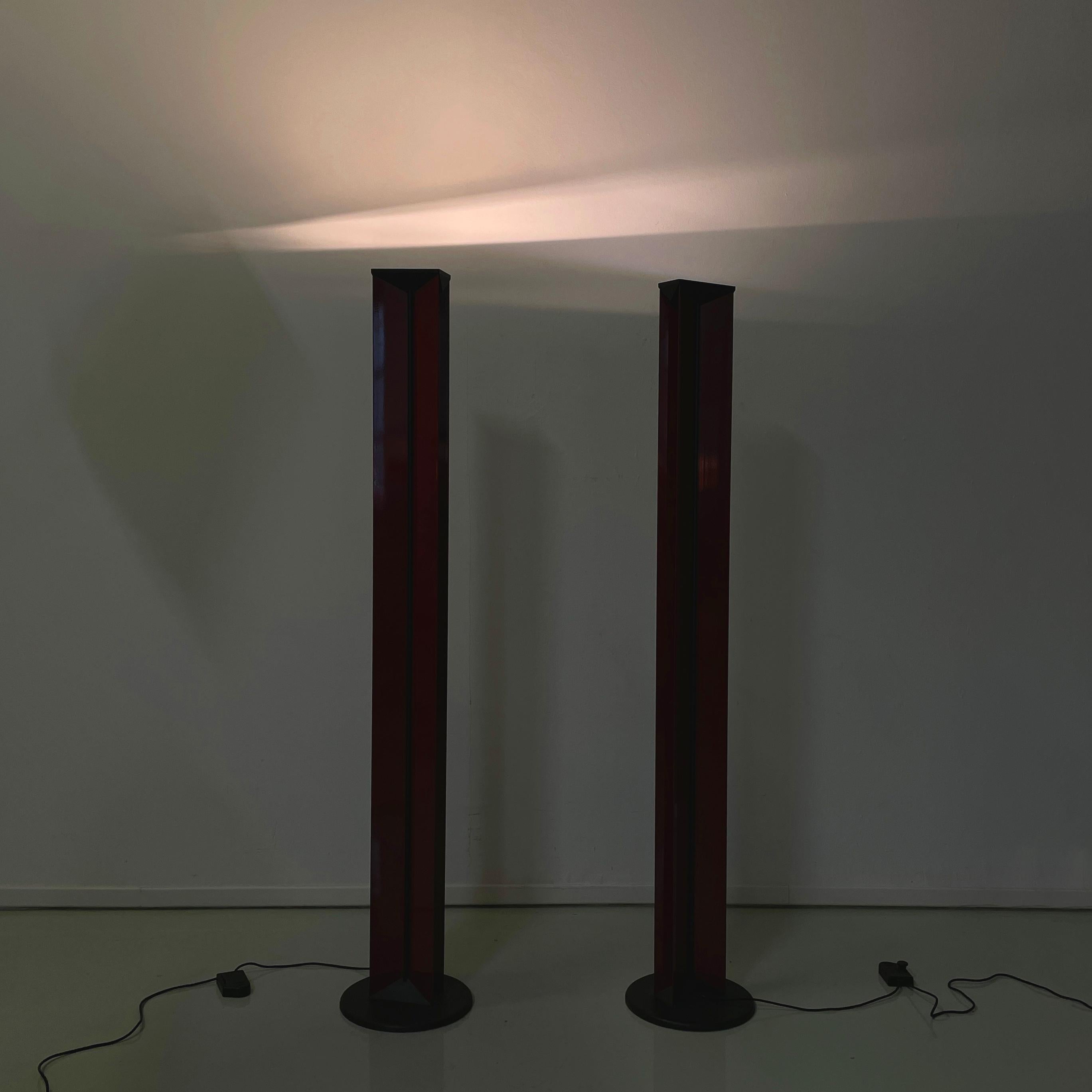 Italian modern Floor lamps in red metal and black plastic by Relco, 1990s
Pair of floor lamps with a structure made of shiny red painted metal sheets, placed in an X shape. In the center of the structure there is a strip of black plastic. In the