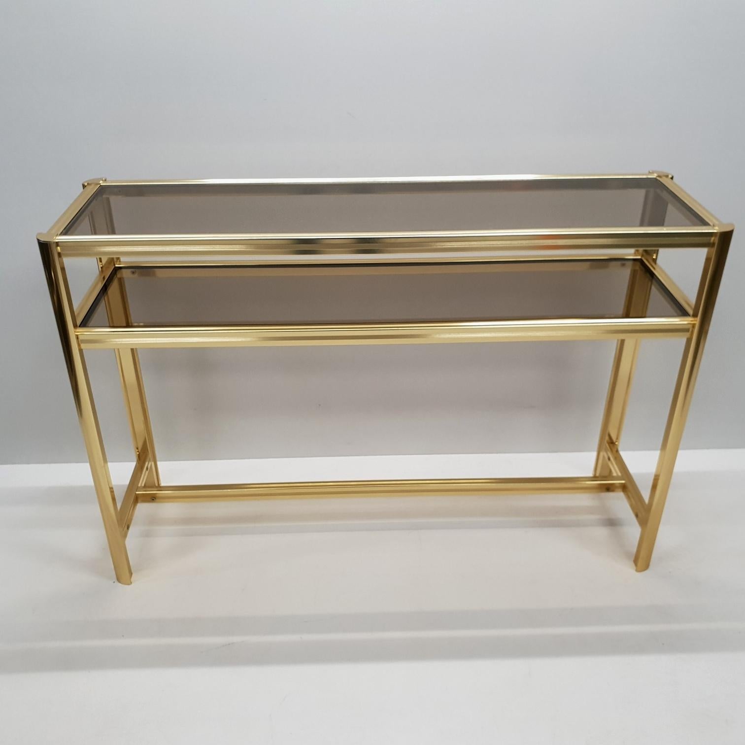 Italian modern gilt brass two tiers side table with smoked glass, 1980s
Excellent vintage condition.