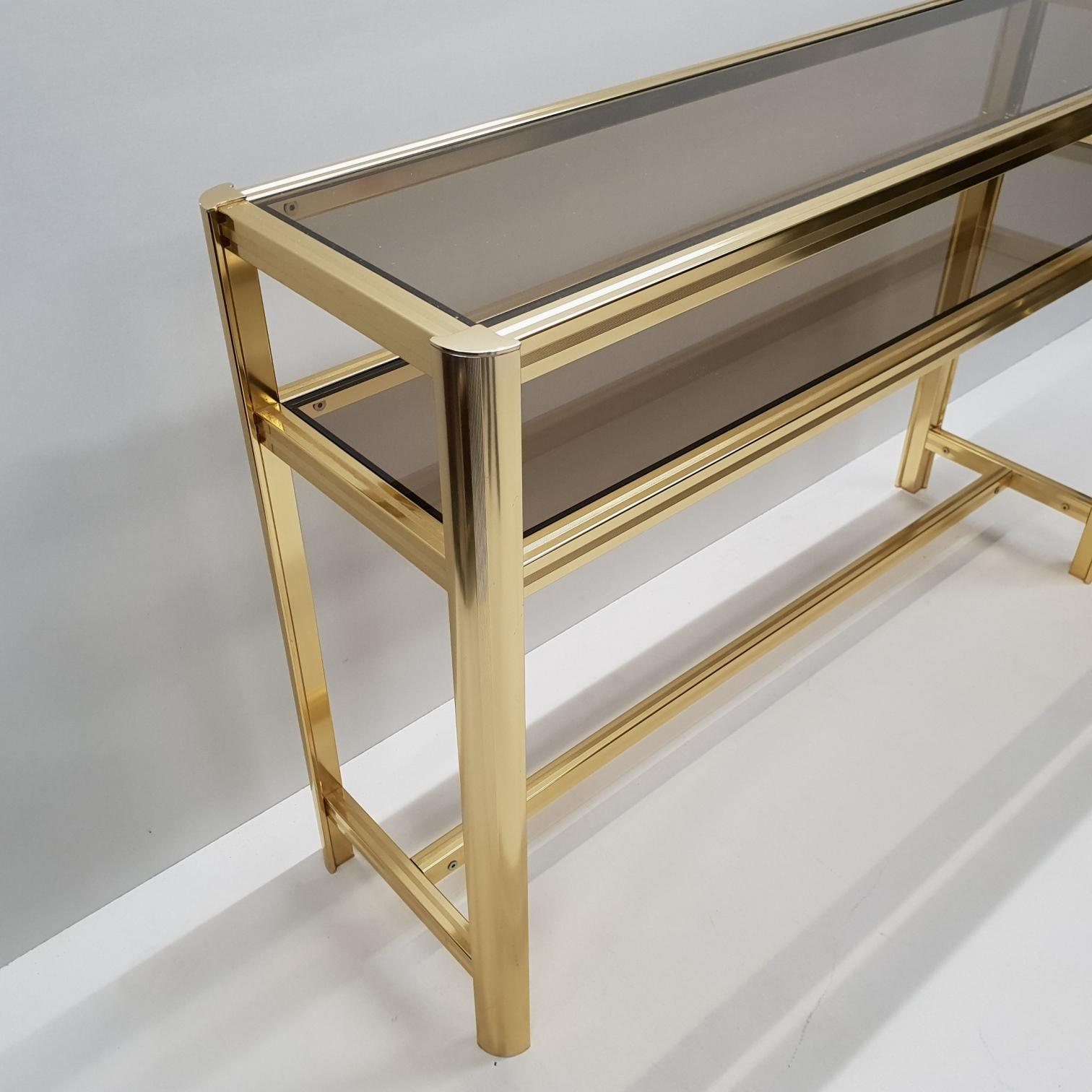 Hollywood Regency Italian Modern Gilt Brass Two Tiers Side Table with Smoked Glass, 1980s For Sale