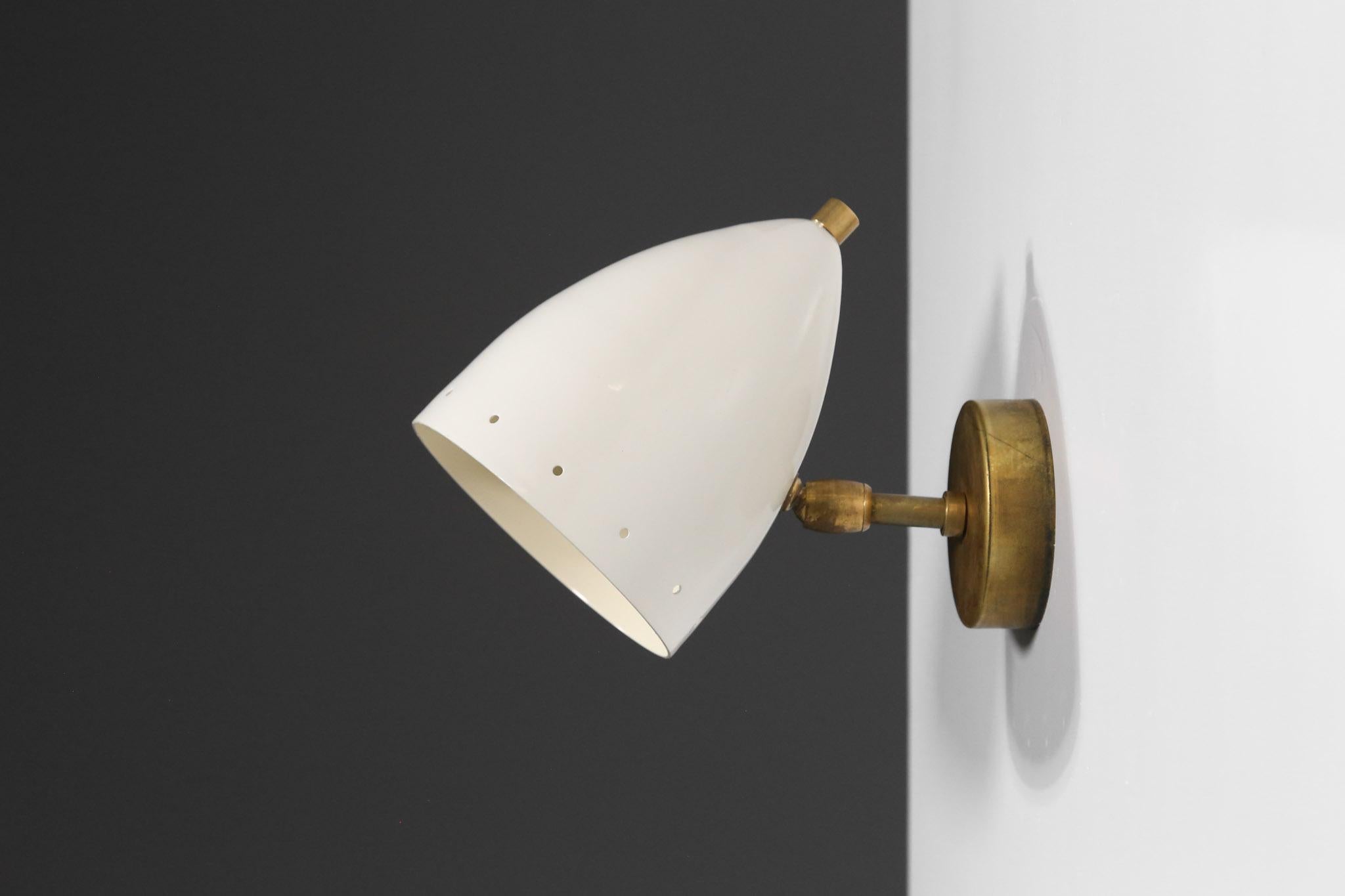 Italian modern diabolo sconces. The lampshades are adjustable and can light in different directions. E14 bulbs per lampshade. Beautiful sculptural and decorative wall light style Stilnovo.
Could be used as a bedside light.