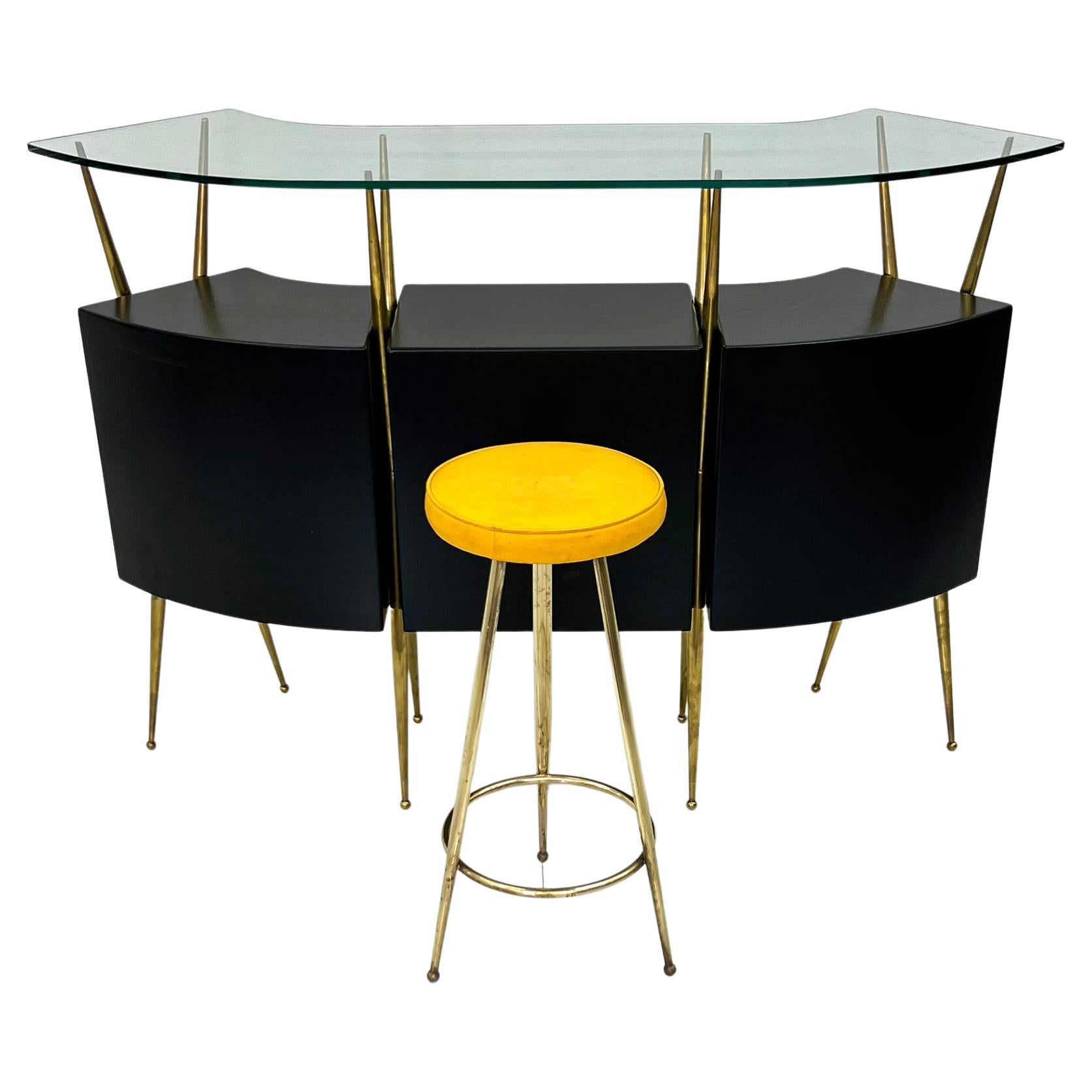 This bar unit is simply stunning-- from every single angle. often attributed to Gio Ponti, this bar features angular brass upright splayed legs, with atomic style ball feet. This bar is so clean, elegant and timeless, it could effortlessly flex into