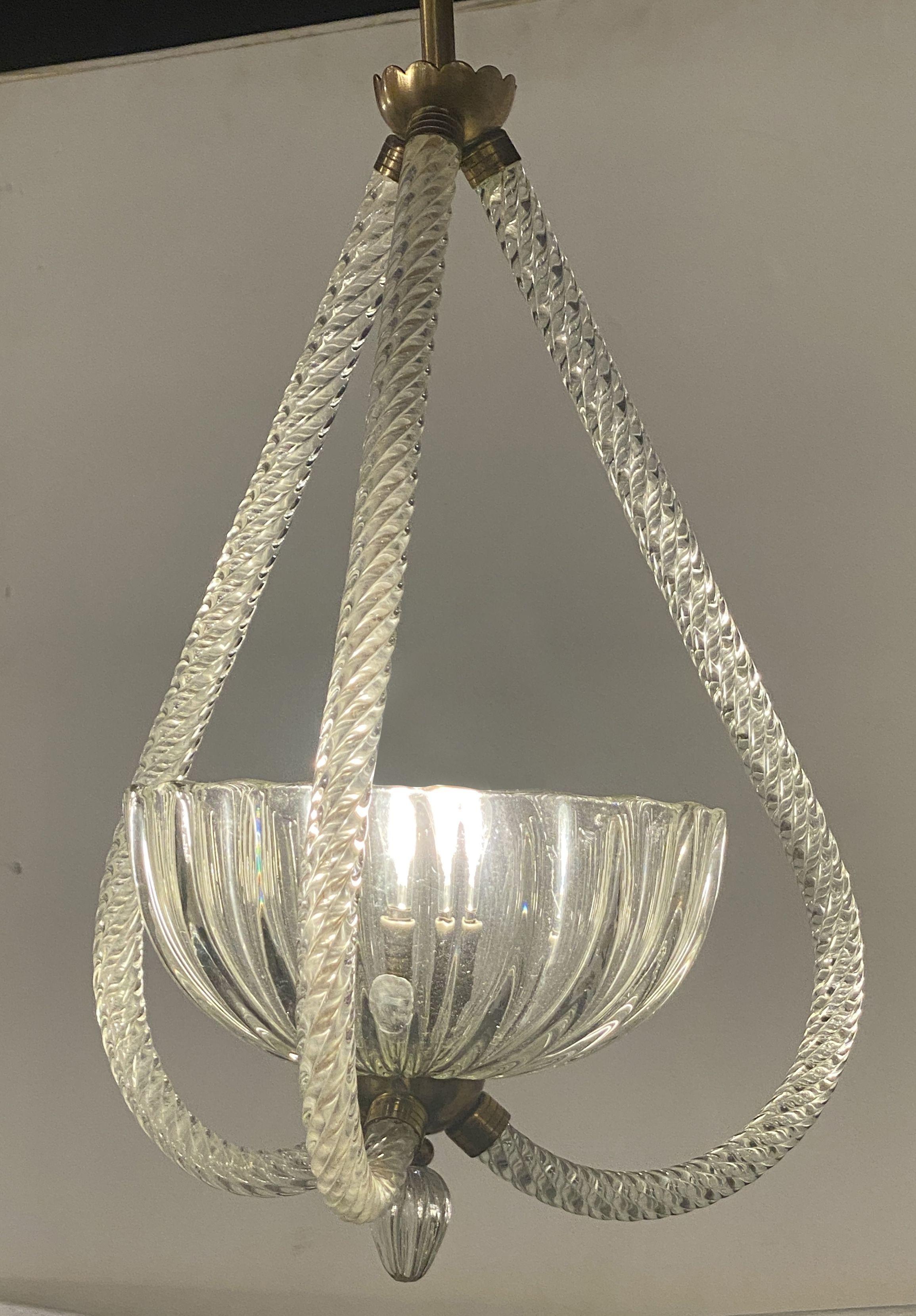 Hand blown glass, central cup with uplight surrounded by 3 arched rope twisted glass elements, joined by a brass section terminating in tear drop glass.