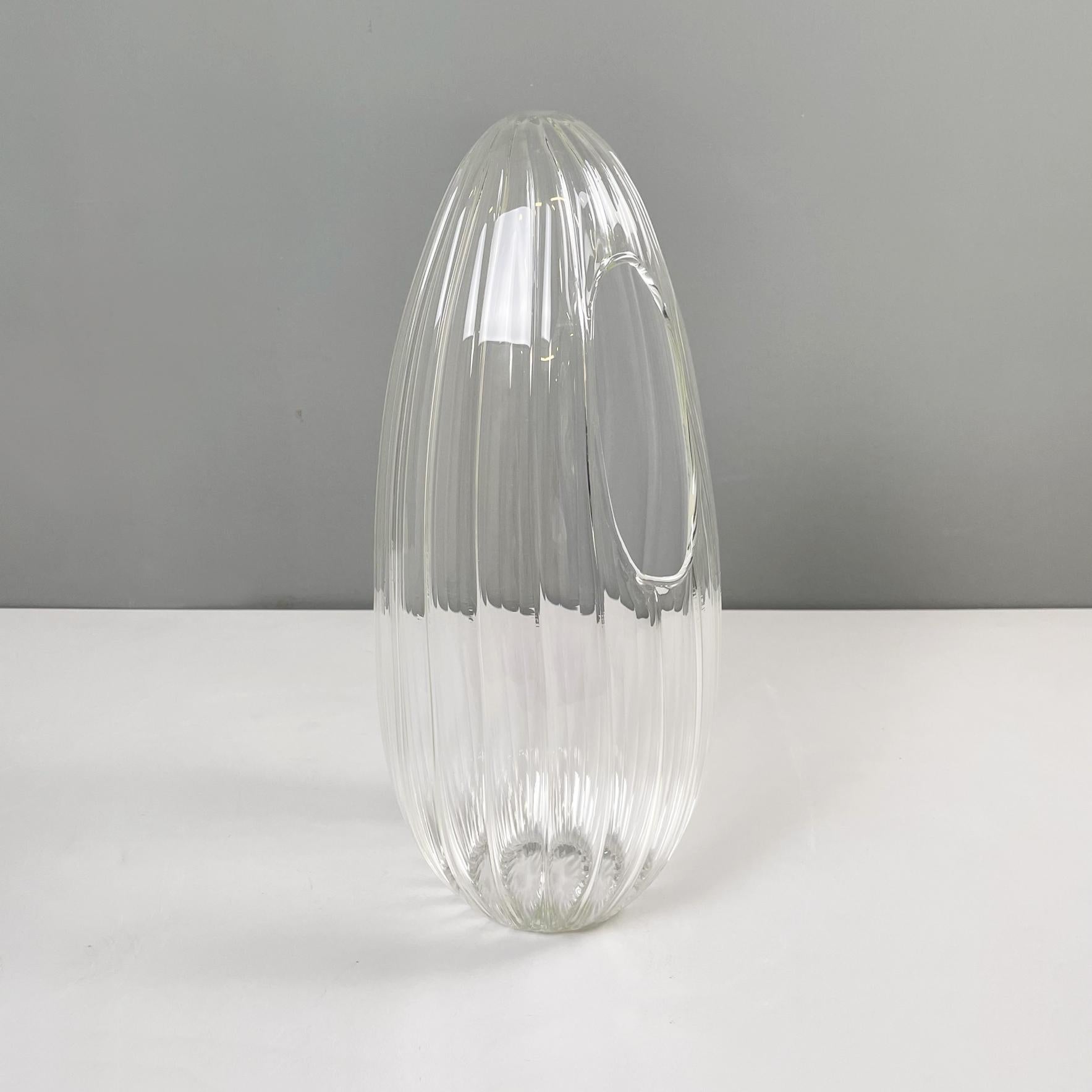 Italian modern Glass vase with round seed shape by Roberto Faccioli, 1990s
Round base vase in finely handcrafted glass. The oval structure resembles the shape of a seed. The vase has the hole on the side.
Designed and produced by Roberto Faccioli in
