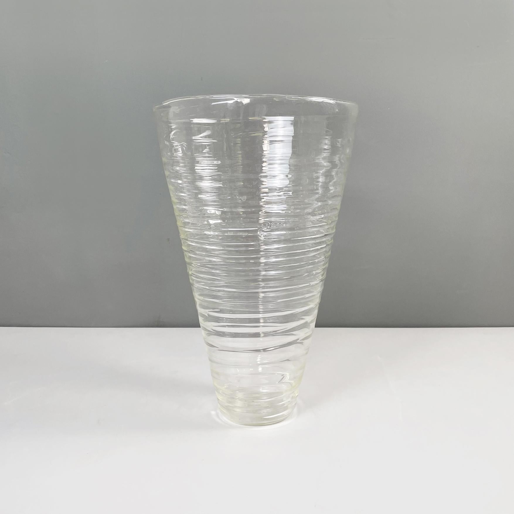 Italian modern Glass vase with round shape and spiral by Roberto Faccioli, 1990s
Round base vase in finely handcrafted glass. The structure tends to narrow towards the base and it has a spiral on the whole surface.
Designed and produced by Roberto