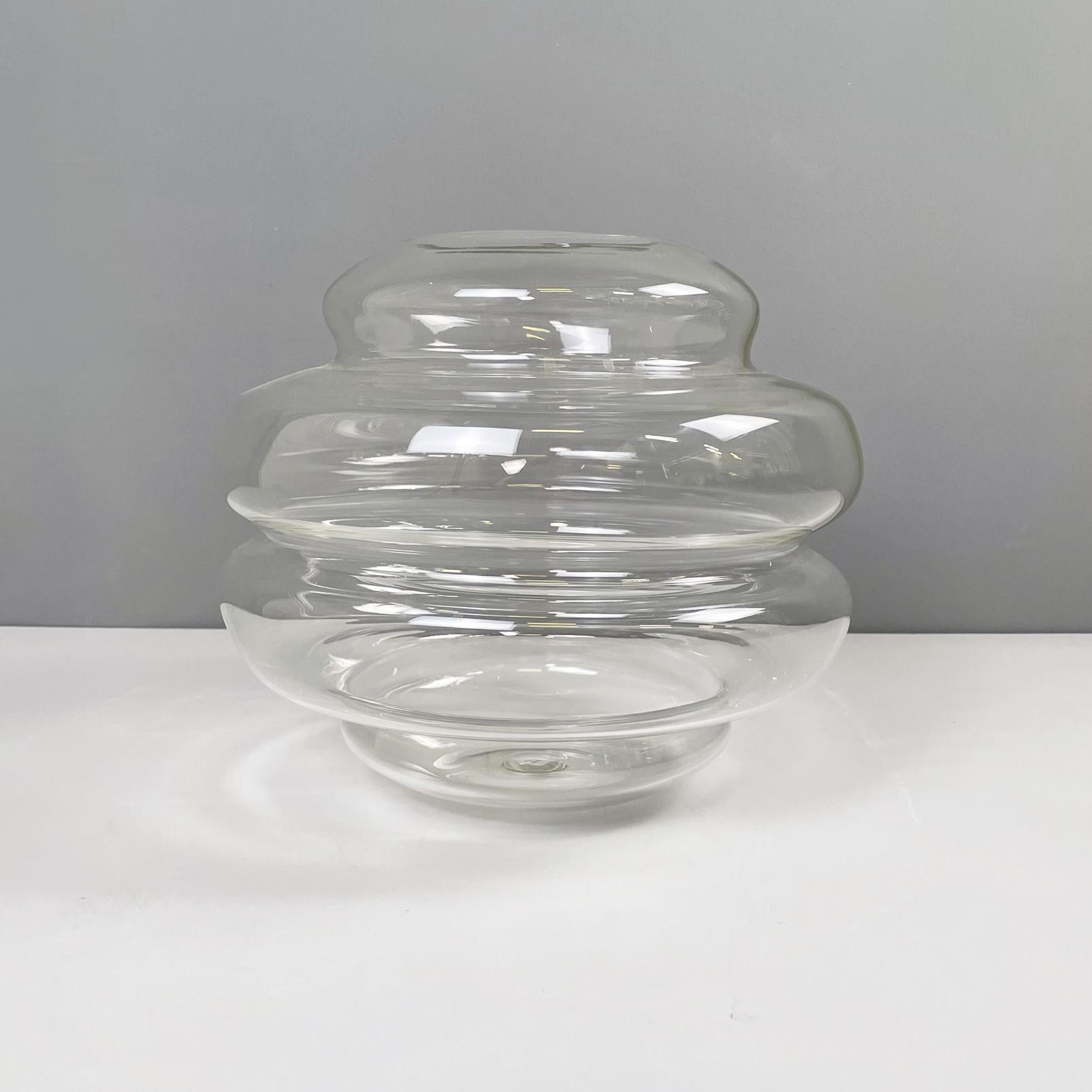 Italian modern Glass vase with round shape by Roberto Faccioli, 1990s
Round base vase in finely handcrafted glass. The structure tends to narrow towards the extremes and widen in the centre, with round shape.
Designed and produced by Roberto
