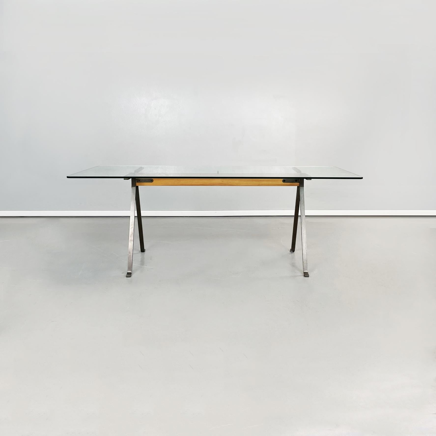 Italian modern glass, steel and wooden dining table Frate by Enzo Mari for Driade, 1973
Dining table mod. Frate with rectangular tempered glass top, with rounded corners. The central structure is composed of a solid wood beam that connects to the
