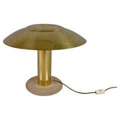 Italian modern golden brass table lamp with a round beige marble base, 1970s