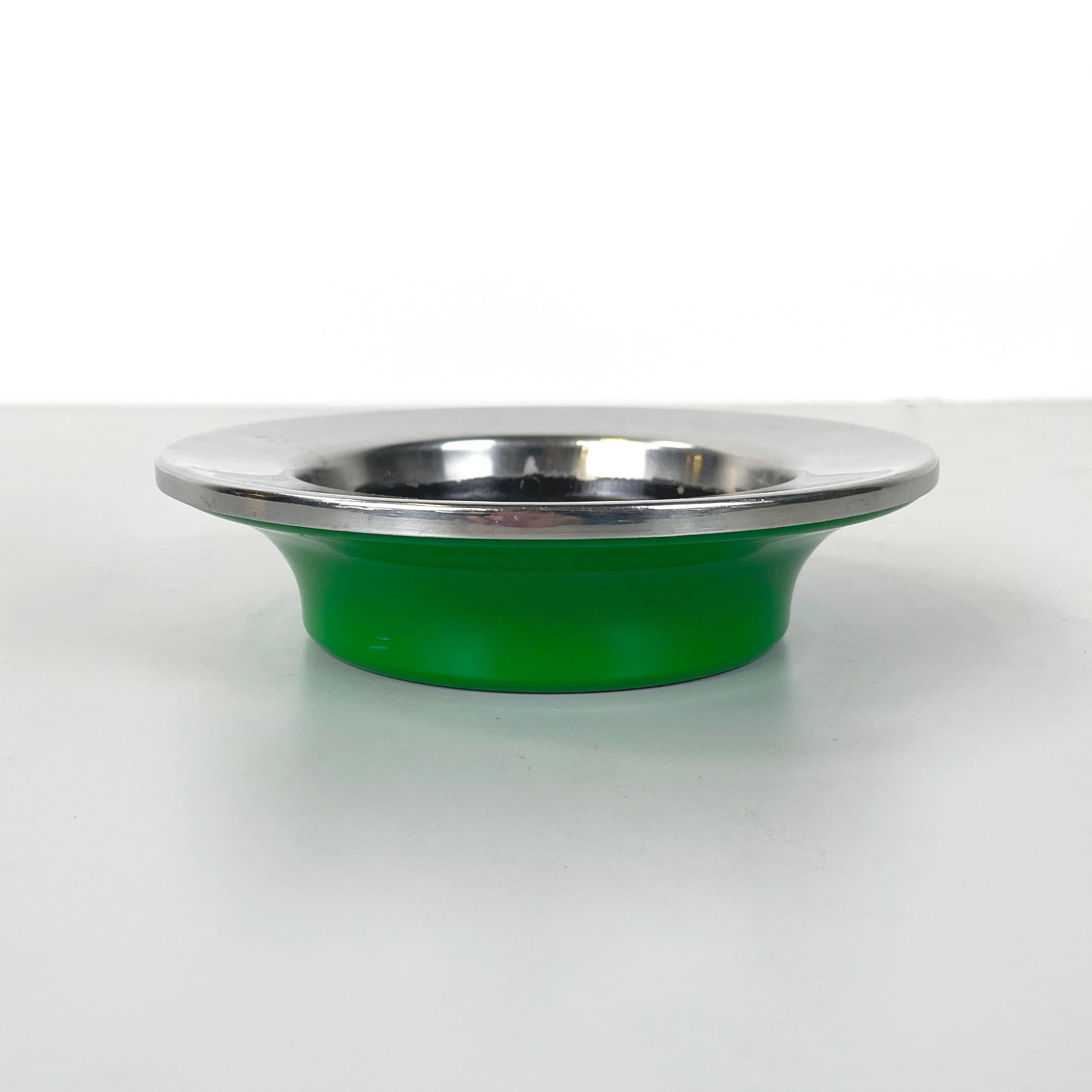 Italian modern Green plastic and metal Ashtray by Gino Colombini for Kartell, 1970s
Round ashtray with black painted metal plate and with cantilevered chromed metal profile. Round base in bright green plastic. It can be used as a