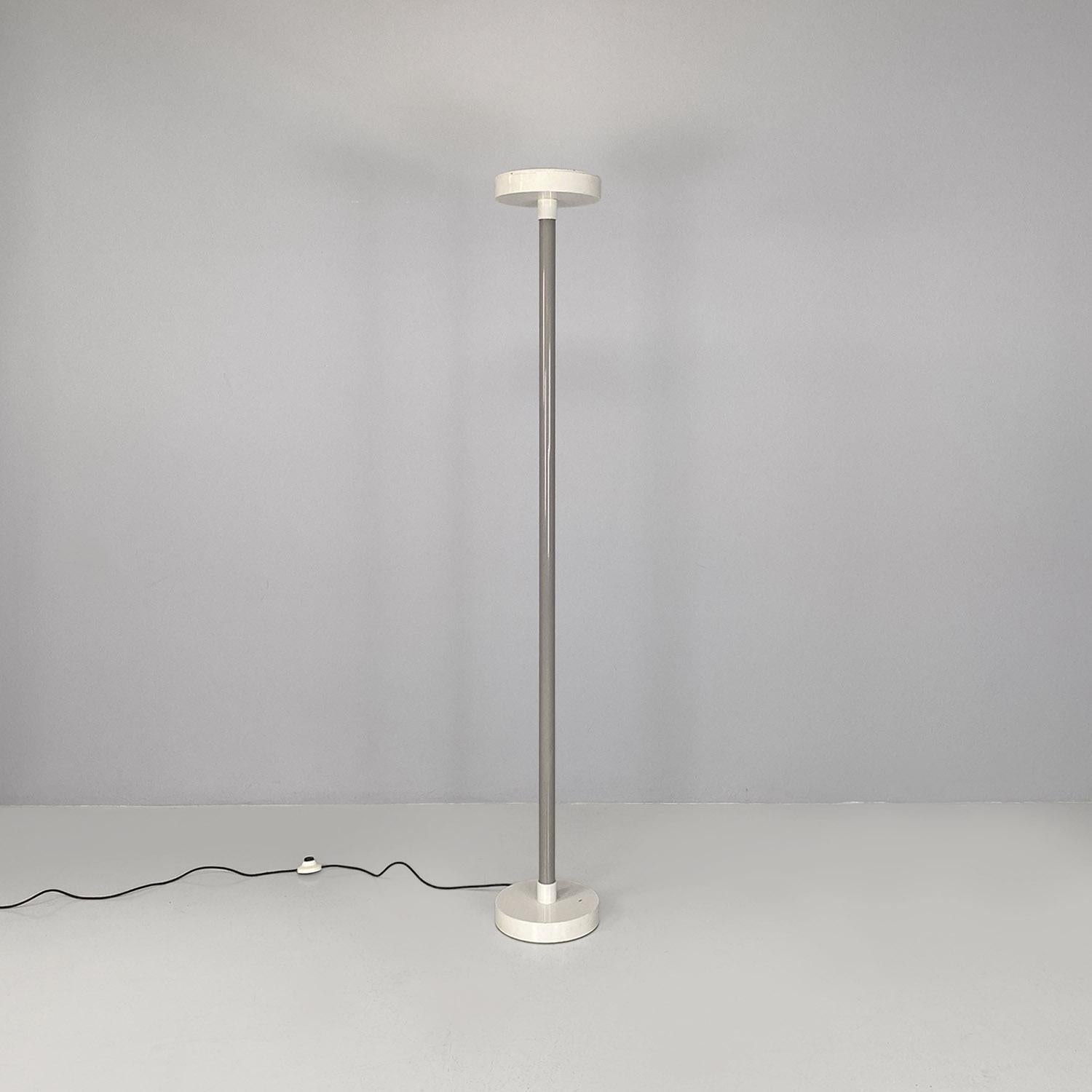 Italian modern grey and white metal floor lamp by Ettore Sottsass for Bieffeplast, 1980s.
Floor lamp composed of a central rod in gray painted metal and two cylinders which make up one the base and the other the lampshade, in white painted metal.