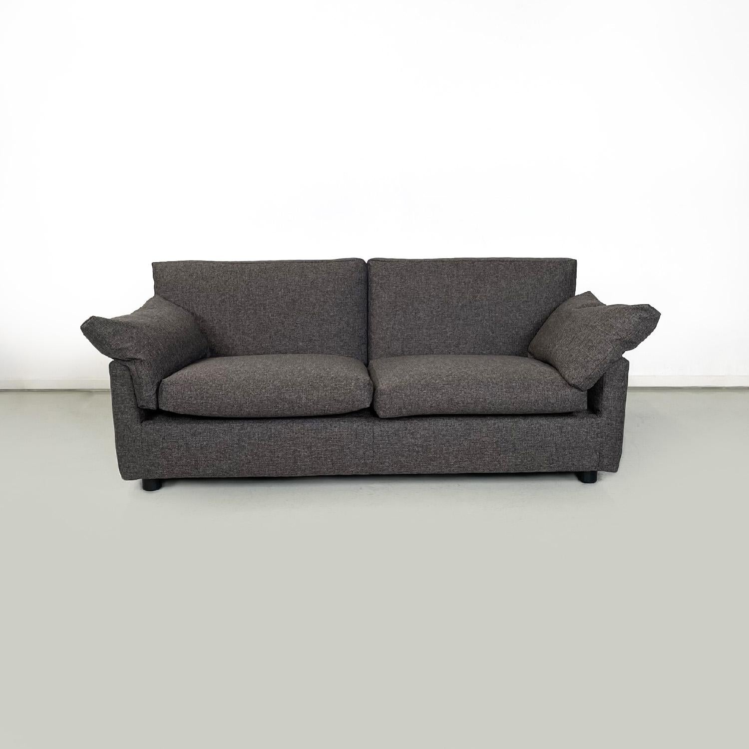 Italian modern grey brown fabric sofa by Flexform, 1990s
Rectangular two-seater sofa. The seat is made up of two cushions which correspond to two other cushions to make up the backrest. The armrests are in turn composed of two cushions that start