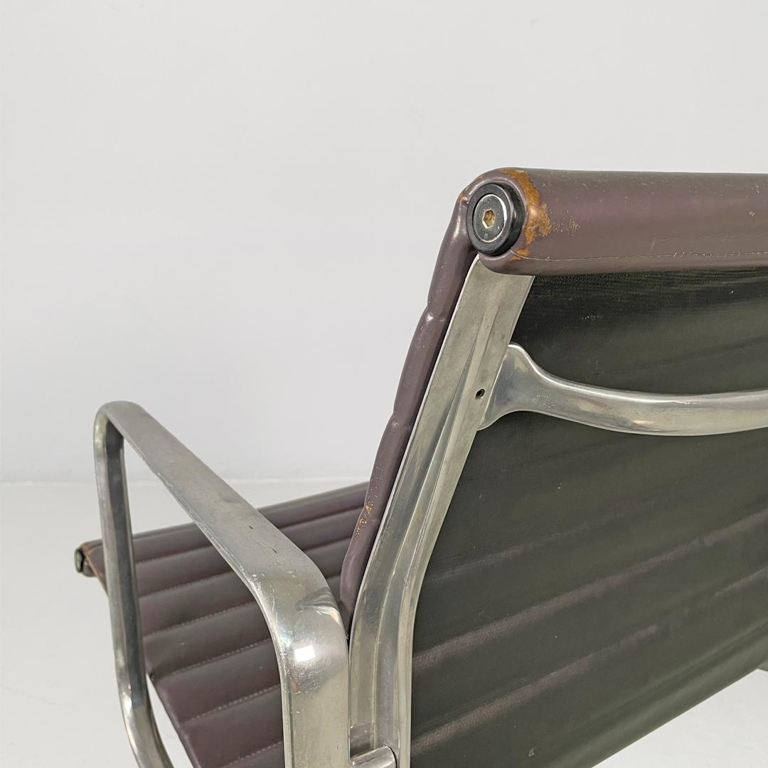 Italian modern dark grey leather office chair by Charles and Ray Eames for ICF, 1970s
Office chair, model EA108 in metal and leather. The seat and backrest are upholstered in dark gray with horizontal stitching. The frame is made of silver-plated