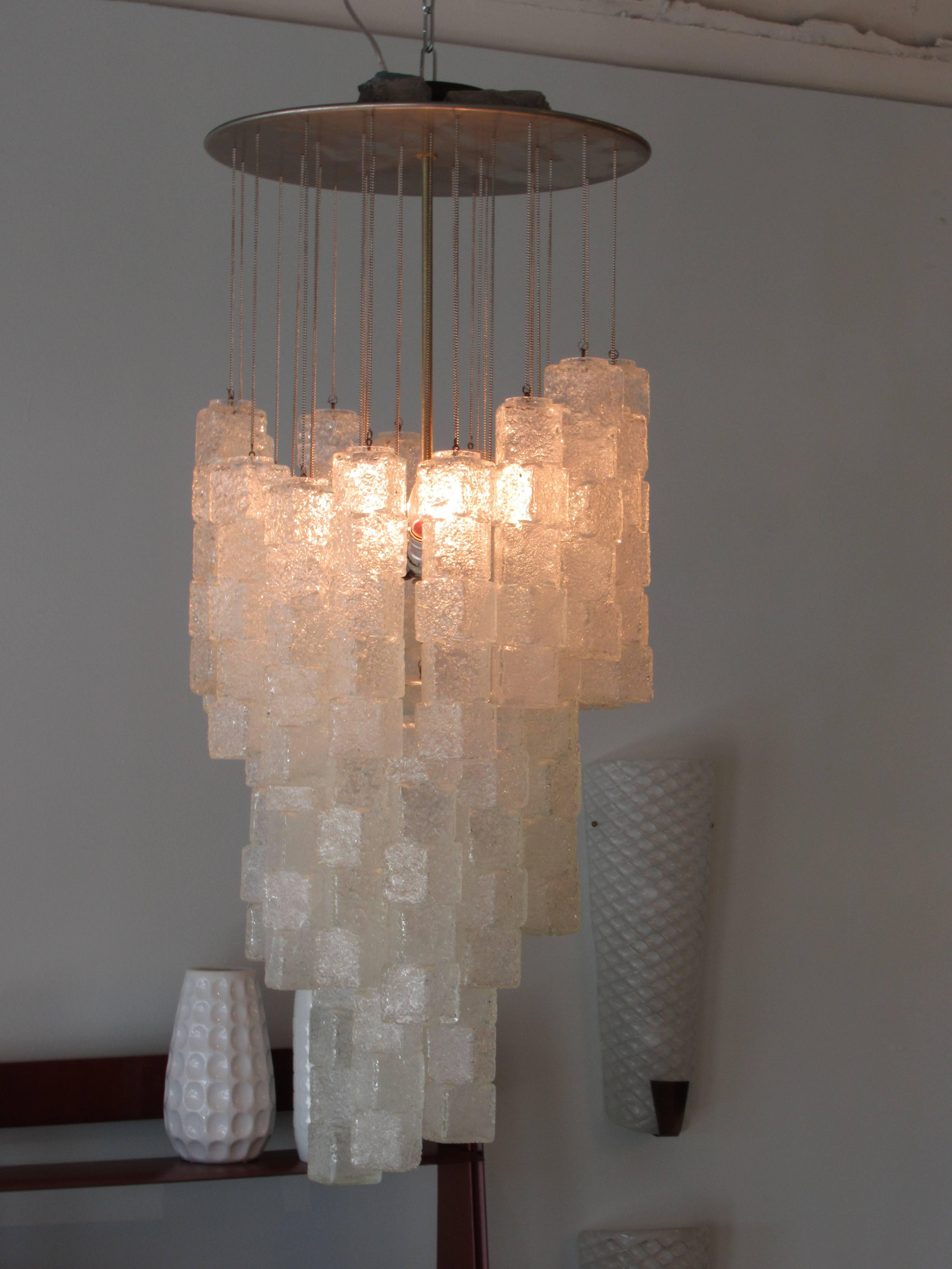 the chrome from with beaded drops of various lengths, with square blown glass cube forms attached- 