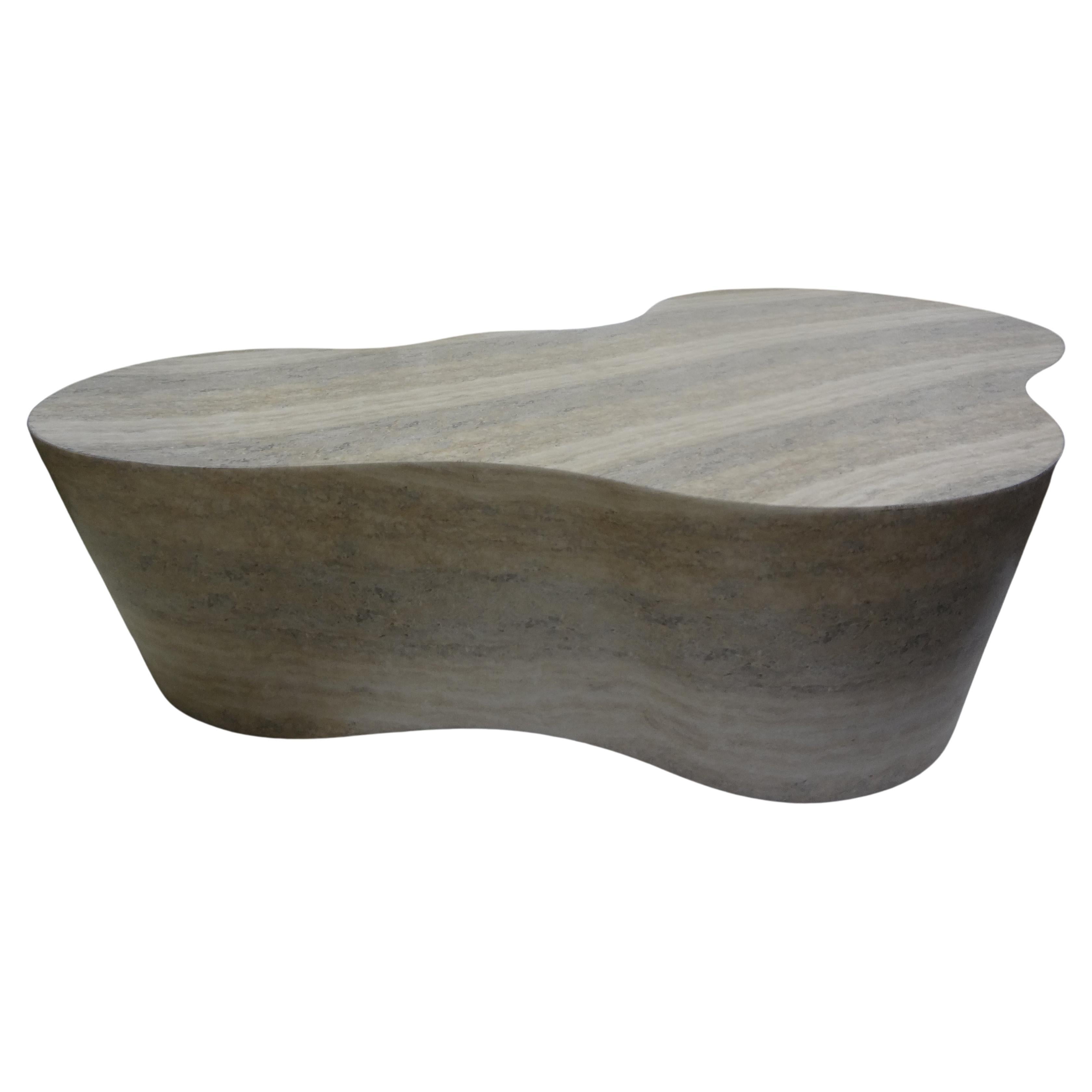Italian Modern Karl Springer Style Travertine Free Form Coffee Table.
Beautifully designed Italian Modern travertine free form or amoeba coffee table or cocktail table. This shapely travertine table is versatile enough to be used in a variety of