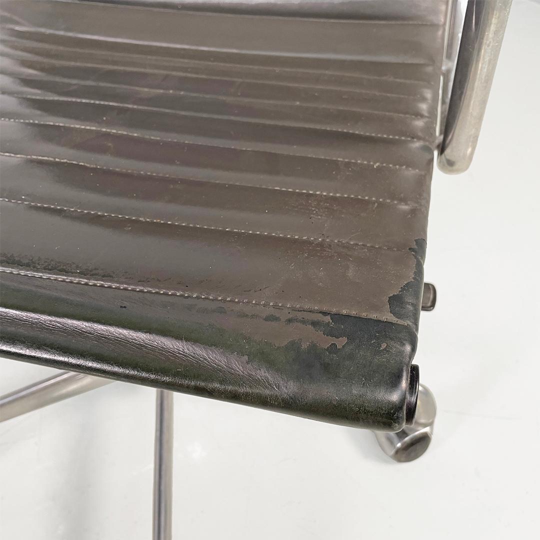 Italian modern dark grey leather office chair by Charles and Ray Eames for ICF, 1970s
Office chair, model EA108, on casters. The seat and backrest are upholstered in dark grey leather with horizontal stitching. The frame is made of silver-plated