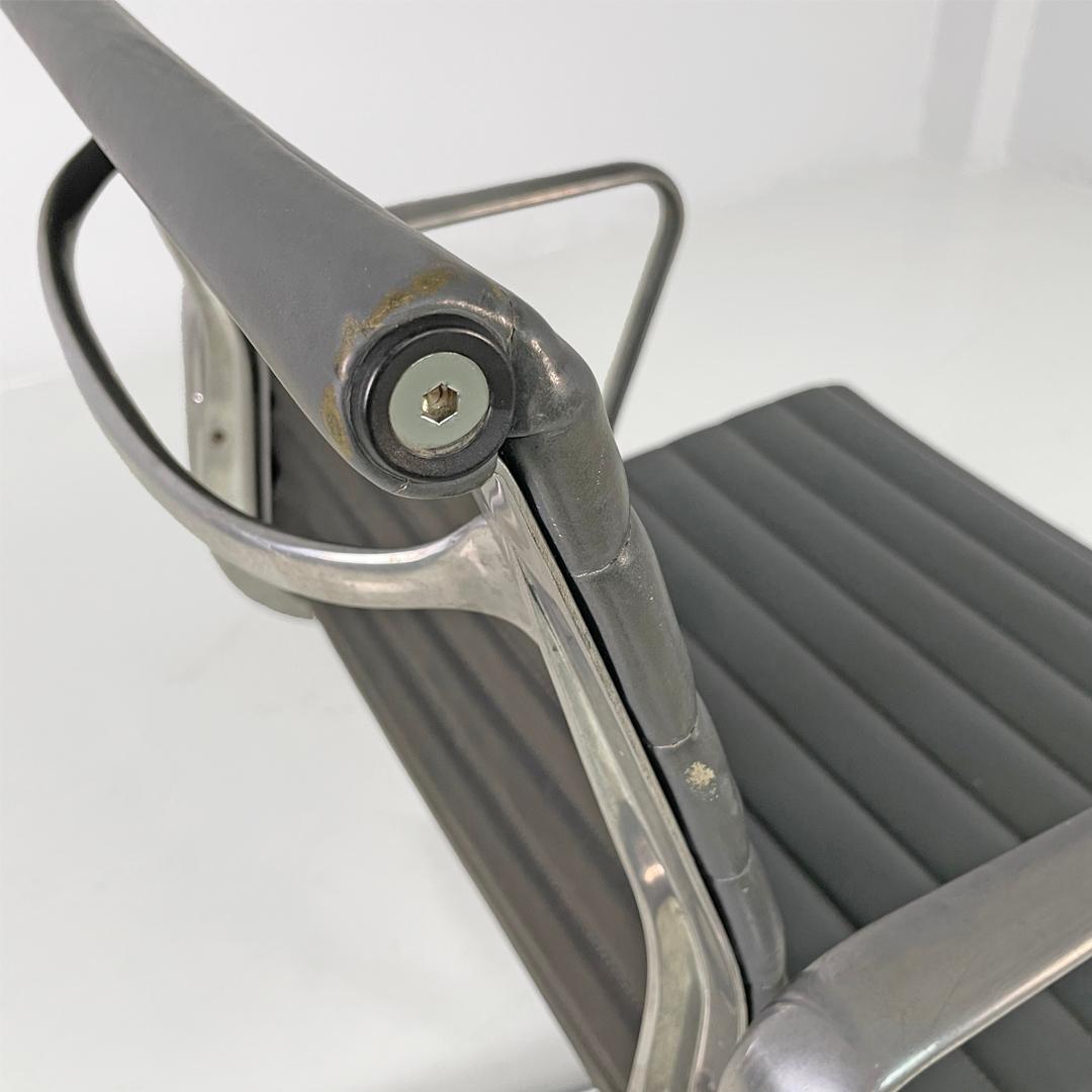 Italian modern dark grey leather office chairs by Charles and Ray Eames for ICF, 1970s
Pair of office chairs, model EA108 in metal and leather. The seat and backrest are upholstered in dark gray with horizontal stitching. The frame is made of
