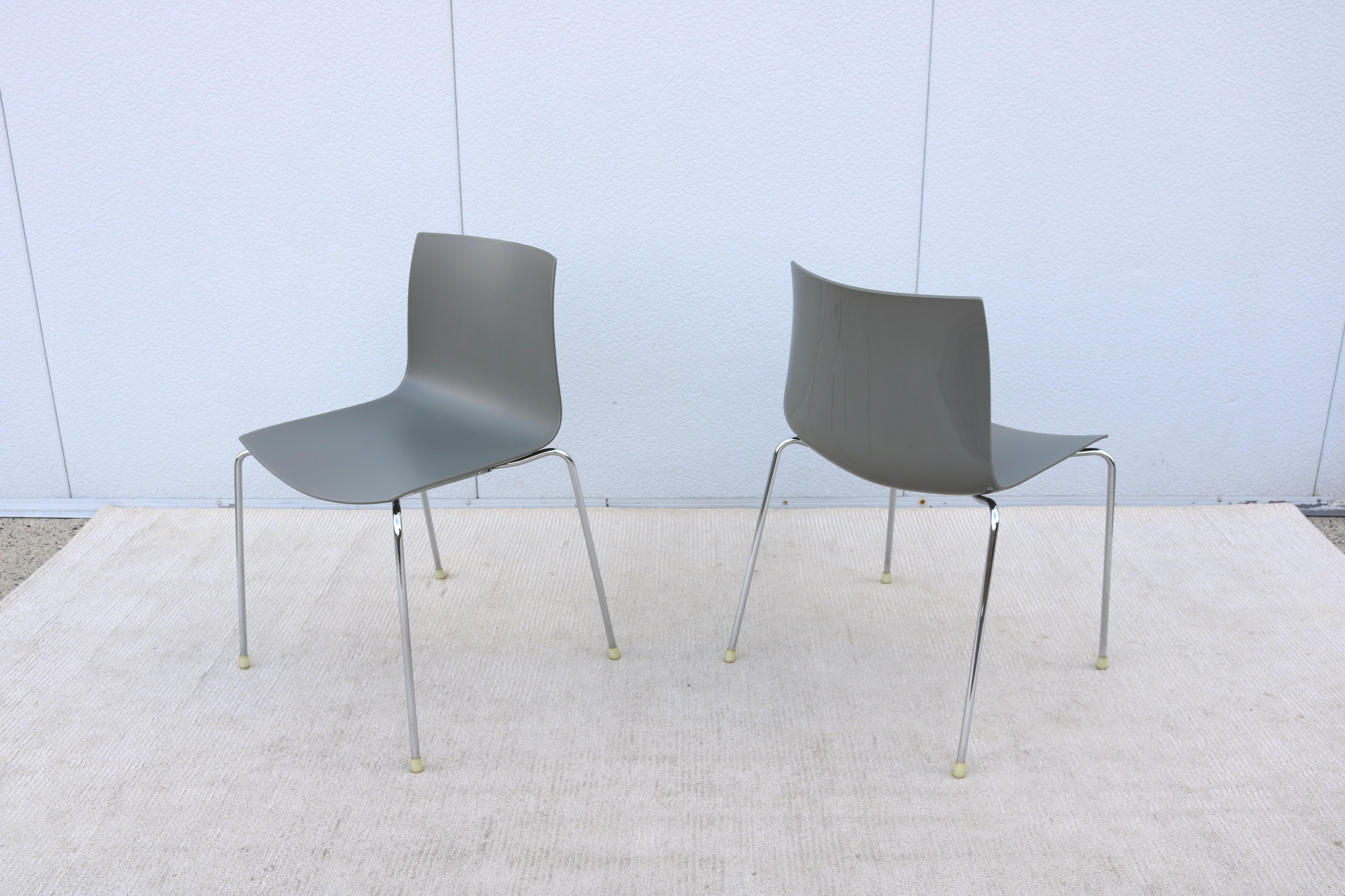 Fabulous pair of Catifa 46 dining chairs designed by Lievore Altherr Molina for the Italian manufacturer Arper.
The classic minimalist look of the Catifa chair is very sleek with a clean contemporary look, it is embracing and thin as a line. 
The