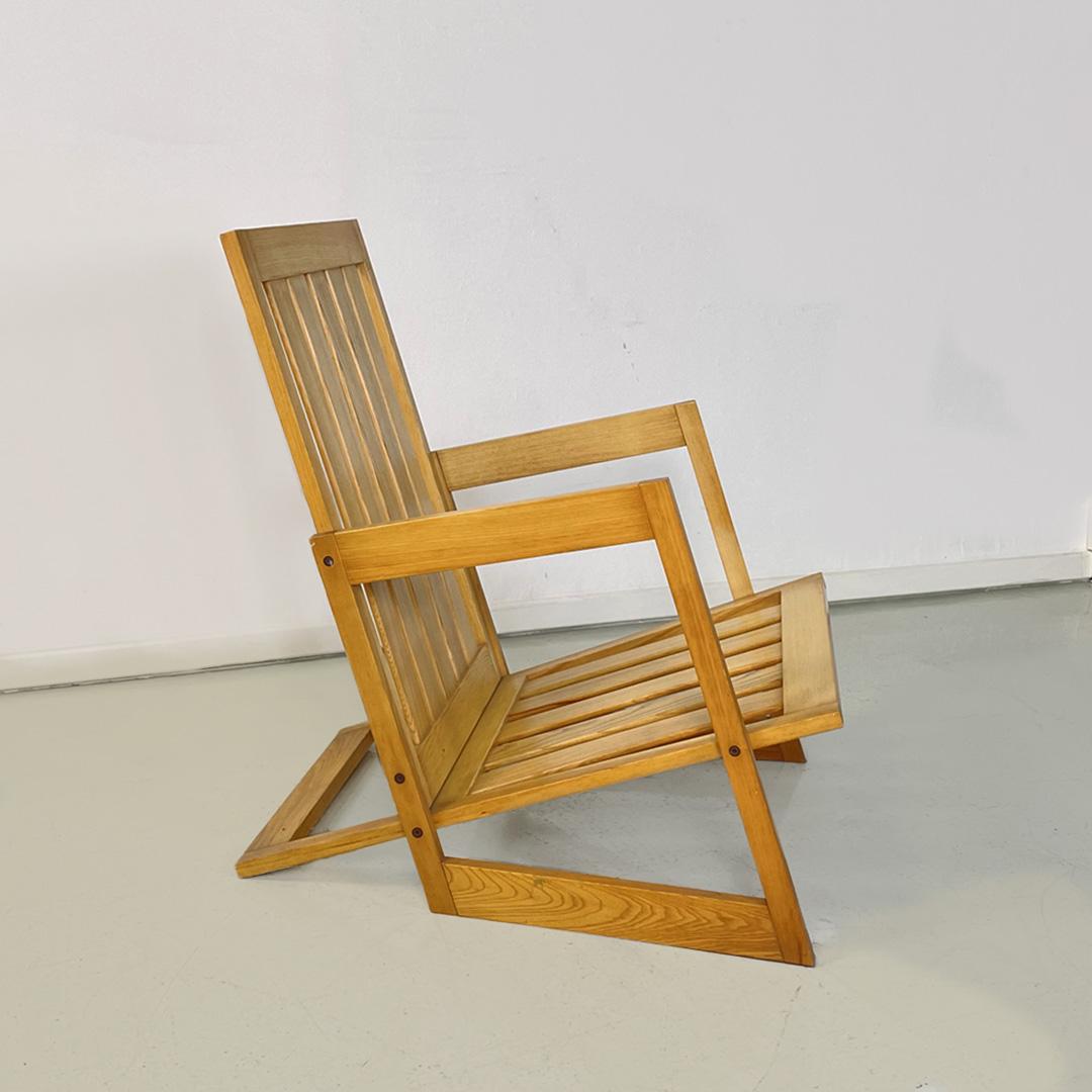 Italian modern wooden armchair, 1980s
Wooden armchair with parallel slats structure on the inclined seat and backrest, squared armrests of irregular shape, Suitable for outdoor use such as garden and terrace.
1980s
Good condition.
Measurements in cm
