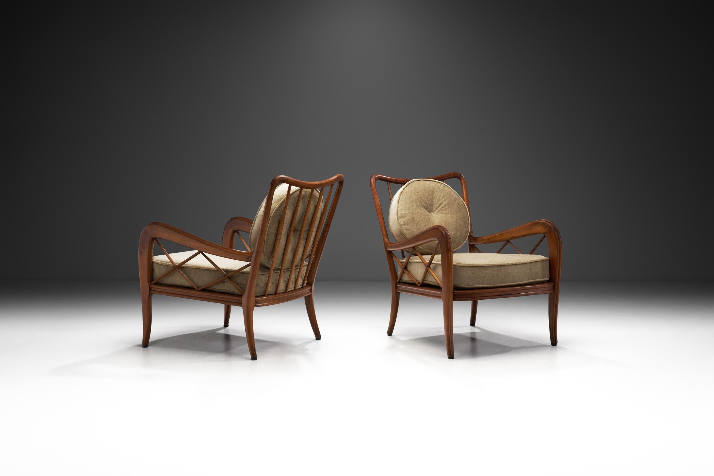 Italian Modern furniture is defined by unique design, perfect execution, and exclusivity. This pair of lounge chairs attributed to Italian design icon Paolo Buffa, are a true testament to the glory days of mid-century modernism in Italy. His design