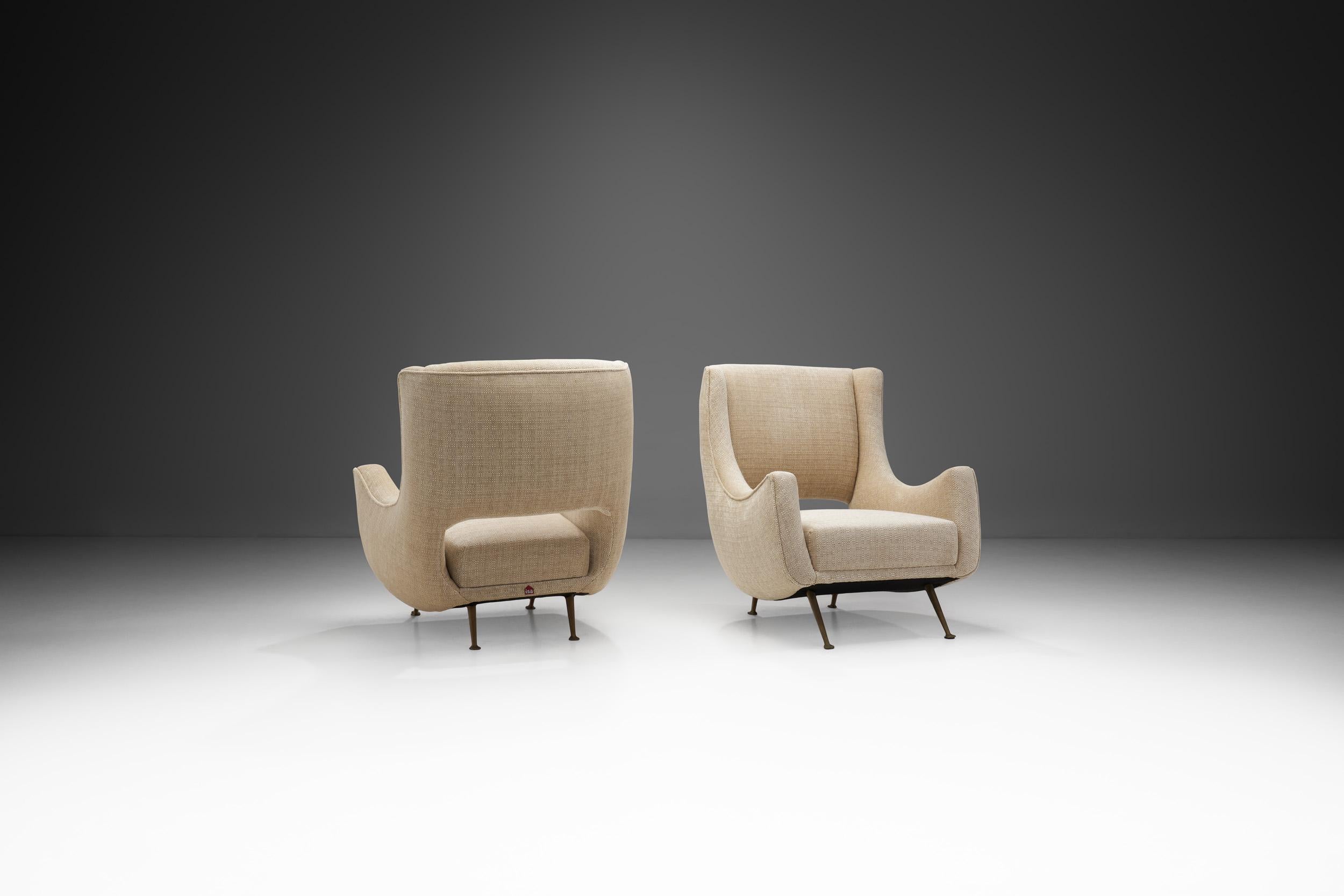 This elegant pair of rare lounge chairs was produced by ISA (Industria Salotti e Arredamenti) Bergamo in Italy during the 1950s. The company has worked with many of Italy’s largest names in design, most renowned being Gio Ponti, but even in their