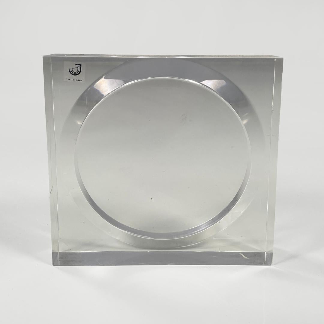 Italian modern lucite frame for Guzzini, 1970s
Transparent lucite frame composed of two pieces, a square base with a recess into which a round is inserted.
Produced by Guzzini in 1970 ca. Label present.
Good condition, has light scattered scratches
