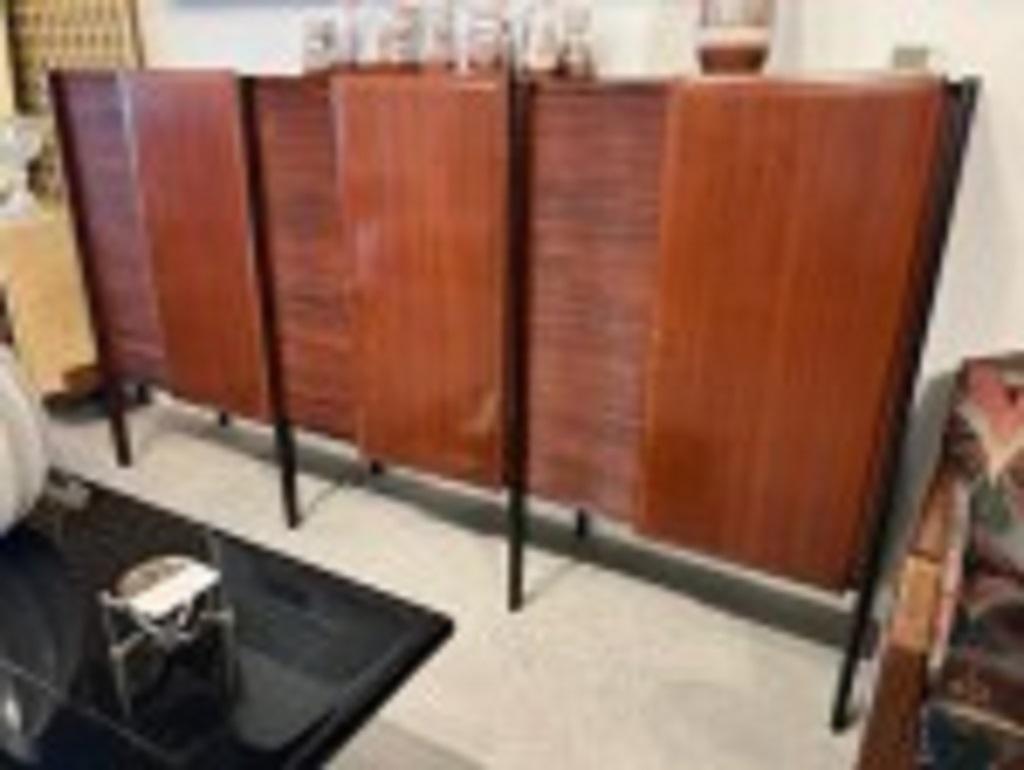 Italian Mid-Century Modern credenza with 3 alternating mahogany and woven panel doors and trimmed with 4 ebonized round columns (Attributed to Gio Ponti)

Condition: Good; Wear consistent with age and use