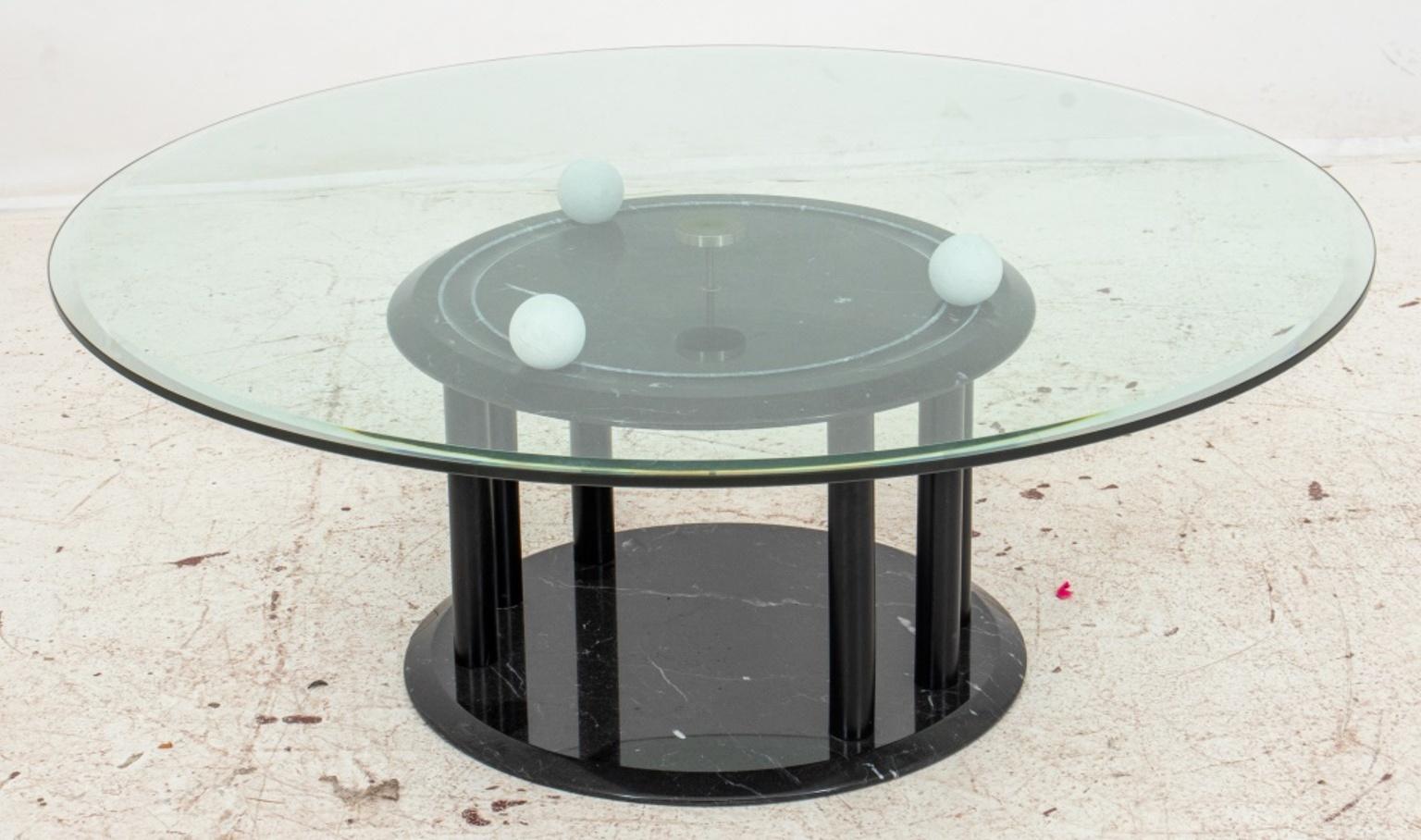 Italian postmodern white and black marble table, with revolving circular glass top, the glass top centered by a chrome gear which allows it to rotate on three white marble spheres above a black marble tempietto on plinth base. Measures: 16
