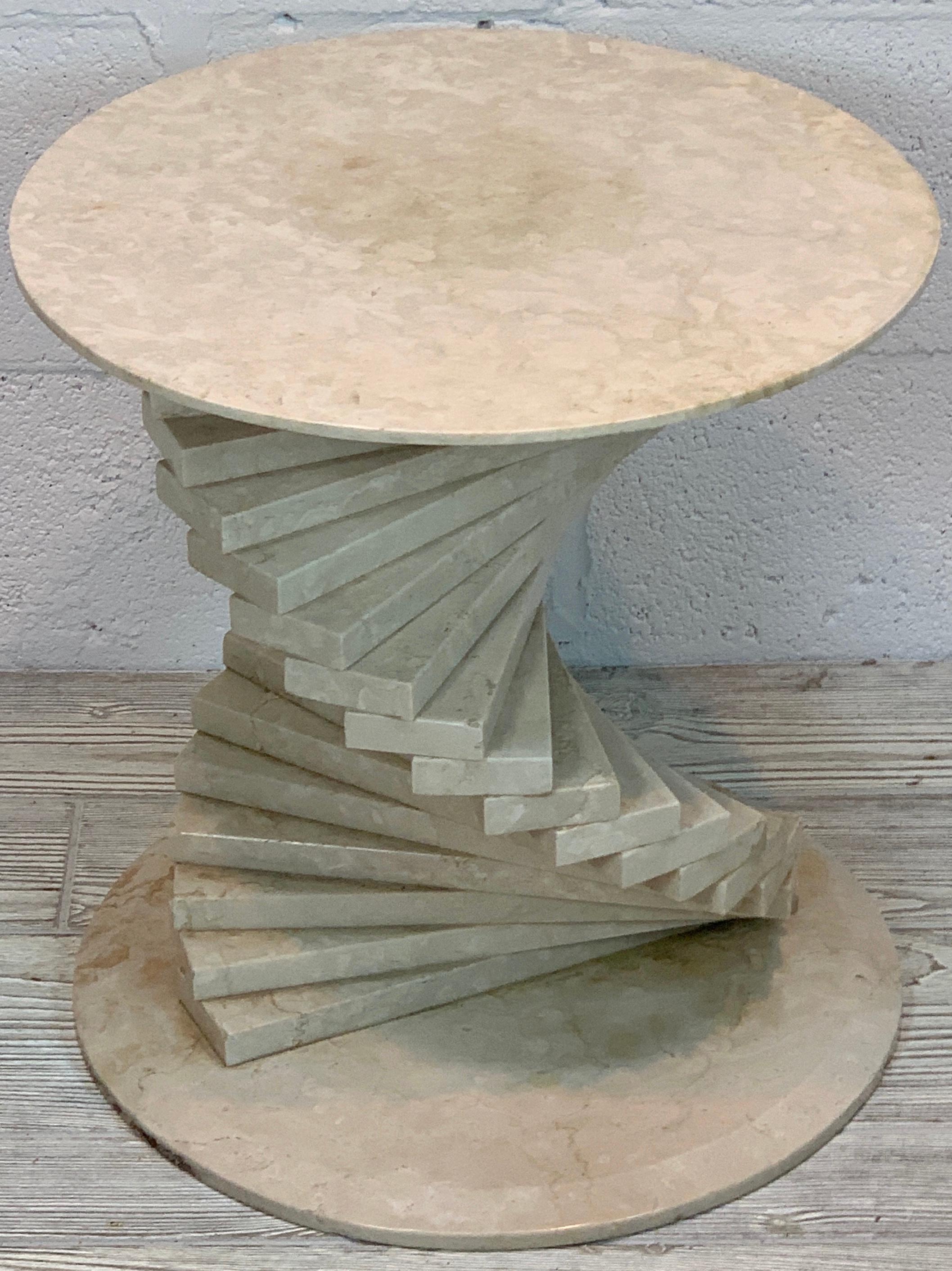 Italian modern marble spiral side table, standing 17- inches high, with a 16-inch diameter top, raised on numerous spiral 'cuboids' resting on a 15.5-inch diameter base.
 