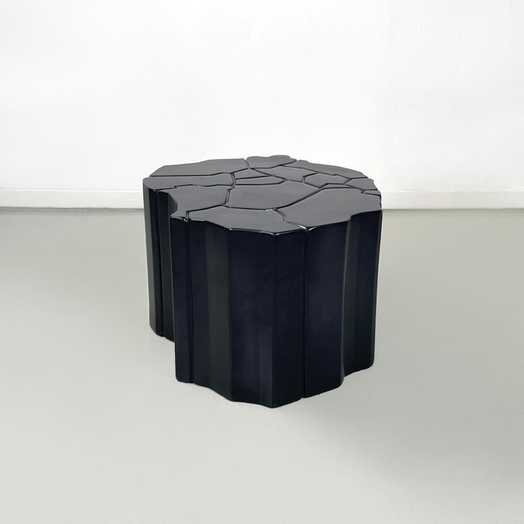 Italian modern mat black ceramic coffee table designed by Roberto Faccioli, 1995
Geometric and rounded table in ceramic, with a mat black paint finish. There is a carved geometric decoration on the ceramic top that continues on the sides making them