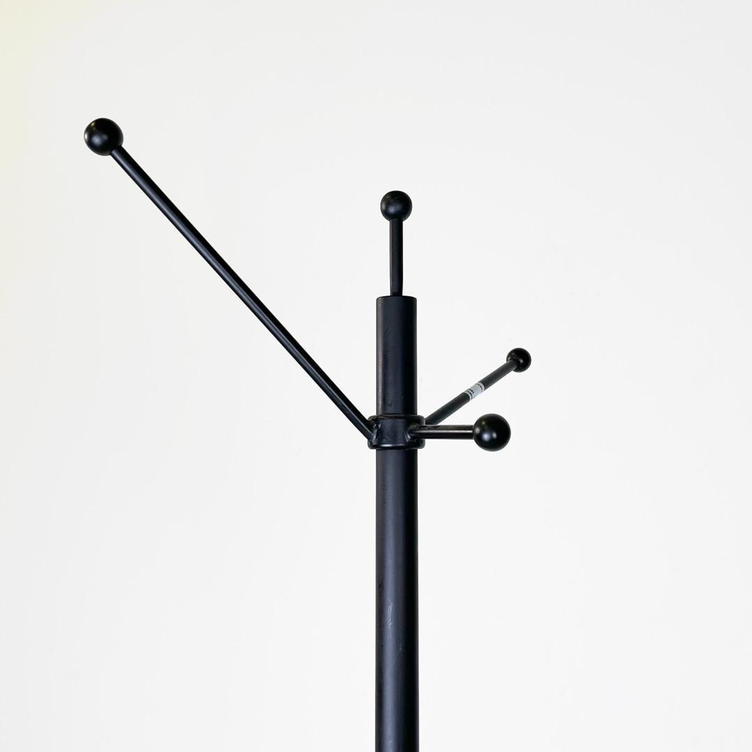 Italian modern matte black metal floor coat hanger concrete cone base, 1980s
Coat hanger with round base. The structure is composed of a central tubular in matte black metal, the coat hangers are placed on the upper part. The four hooks are in matte