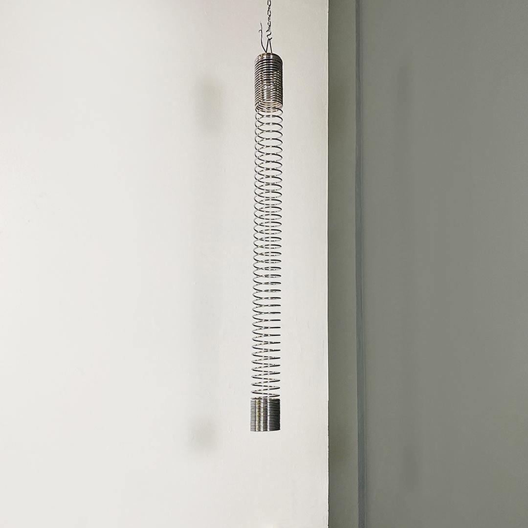 Italian modern chromed metal elastic Molla ceiling lamp by Angelo Mangiarotti for Candle, 1974.
Molla model ceiling lamp, with chromed metal structure, elastic like a spring, containing an E27 lamp holder at the upper end.
Project by Angelo