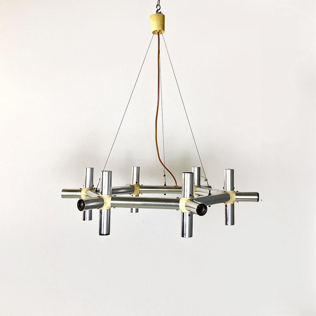 Italian modern metal and plastic Atomic chandelier by Robert and Trix Haussmann for Swiss Lamps International, 1970s.
Atomic model chandelier, with metal structure with satin finish, reminiscent of atomic compounds, with beige plastic joints.