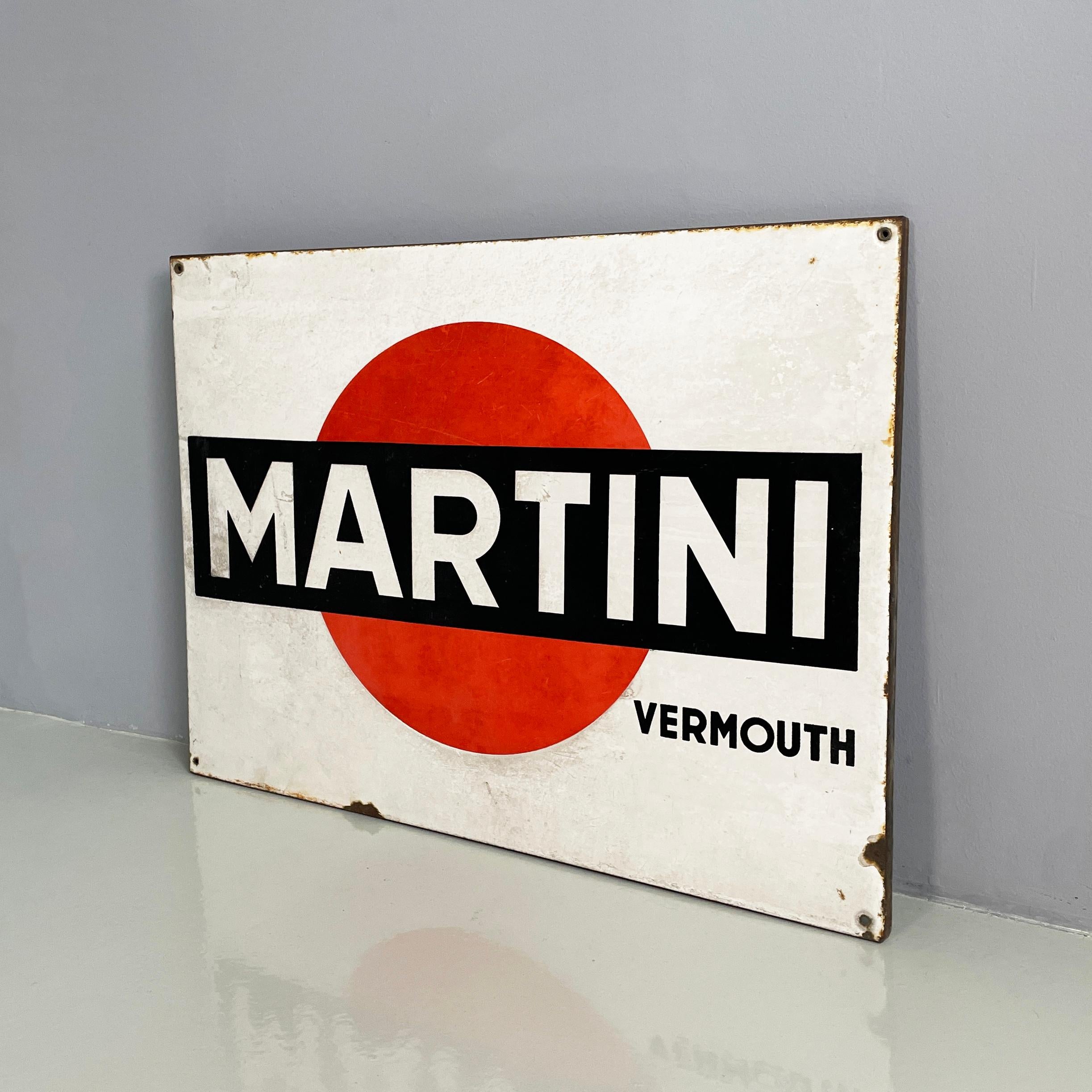 Italian modern Metal wall advertising sign of Martini Vermouth, 1960-1980s
Martini Vermouth wall advertising sign in painted metal. In the center there is the writing Martini in a black rectangle with a red circle. Below there is the writing