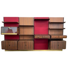 Unité murale modulaire italienne moderne du milieu du siècle dernier en bois de rose, laine et laiton