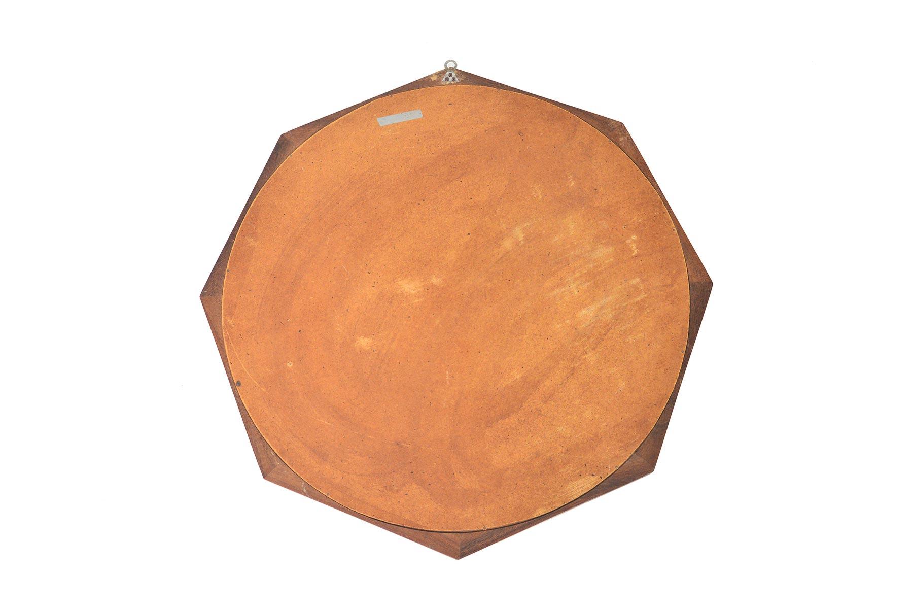 This stunning Italian Mid-Century Modern wall mirror is crafted from solid walnut to create an elegant octagon shape. In excellent original condition with typical wear for its vintage.
 