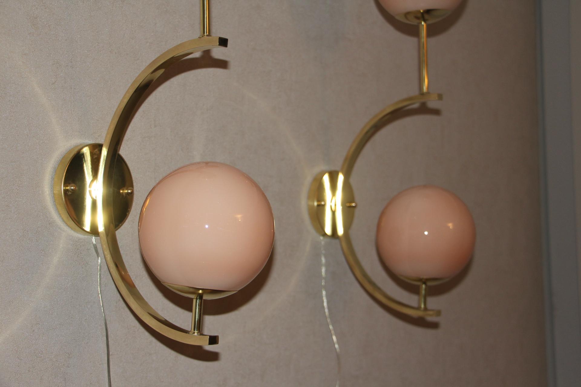 These sconces are very elegant with their brass frame and beautiful beige-salmon color Murano glass globes. They have got very unusual geometrical proportions and are very elegant.
Take E14 bulbs. Wired for U.S.
Each sconce is 3 kg.
Globes are