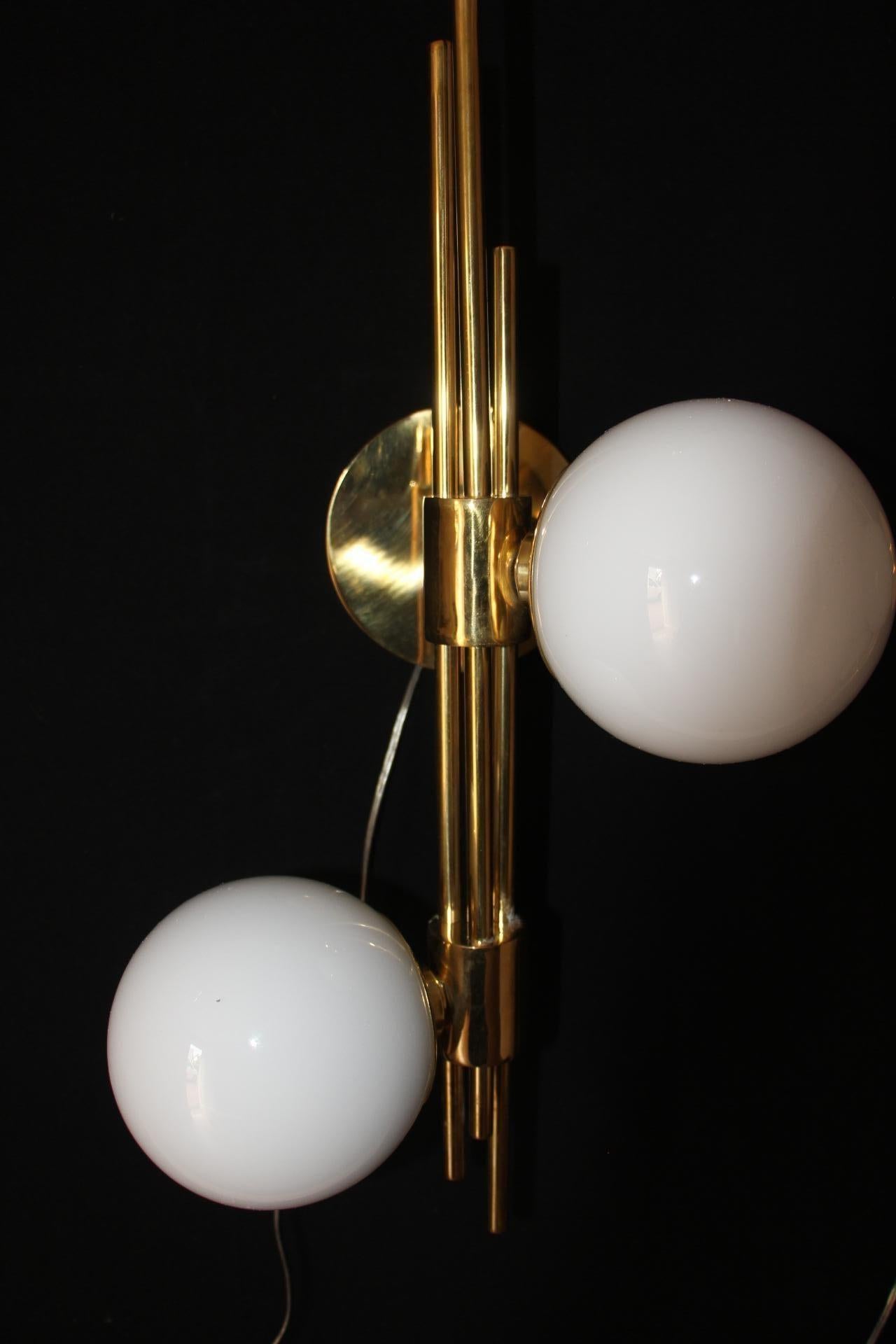 These sconces are very chic with their brass frame and white Murano glass domes. They have got very unusual geometrical proportions and are very elegant.
Takes E14 bulbs. Wired for U.S.
Each sconce weight's is 4 kg.They are wired for the US and work