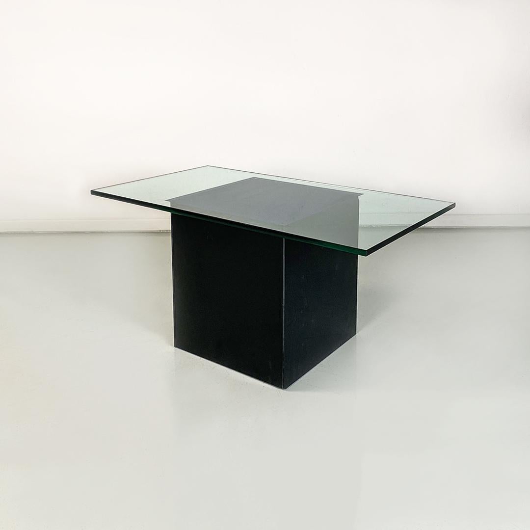 Italian modern wood, mirrored black glass and transparent glass Blok coffee or cocktail table by Nanda Vigo for Acerbis, 1970s.
Blok model coffee table, with cubic base with wooden faces covered with mirrored black glass and rectangular glass top,