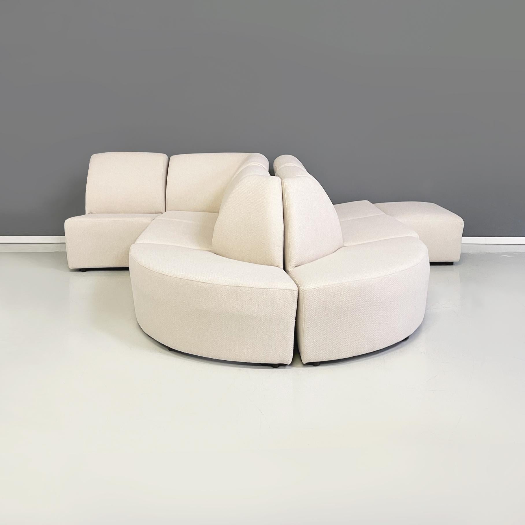 Italian modern Modular and corner sofa in white fabric, 1980s
Modular and corner sofa entirely upholstered and covered in cream white fabric. The sofa has a square seat and a rounded backrest. The two external modules have a semicircle seat. There