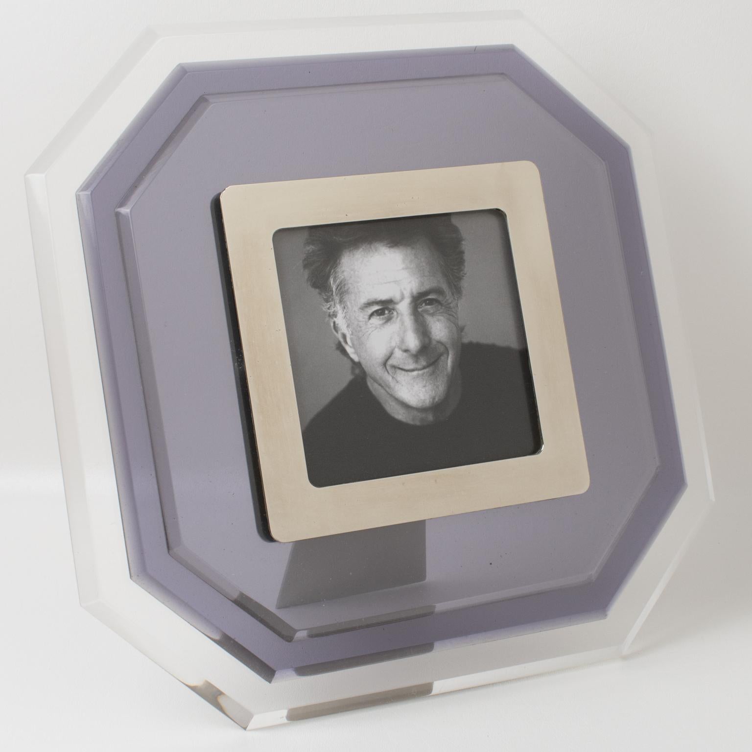 This beautiful and substantial Italian modern Lucite picture photo frame was designed in the 1980s. It features an octagonal shape with multilayers Lucite construction, with transparent color contrasted with a smoke blue-gray tone. The view image is