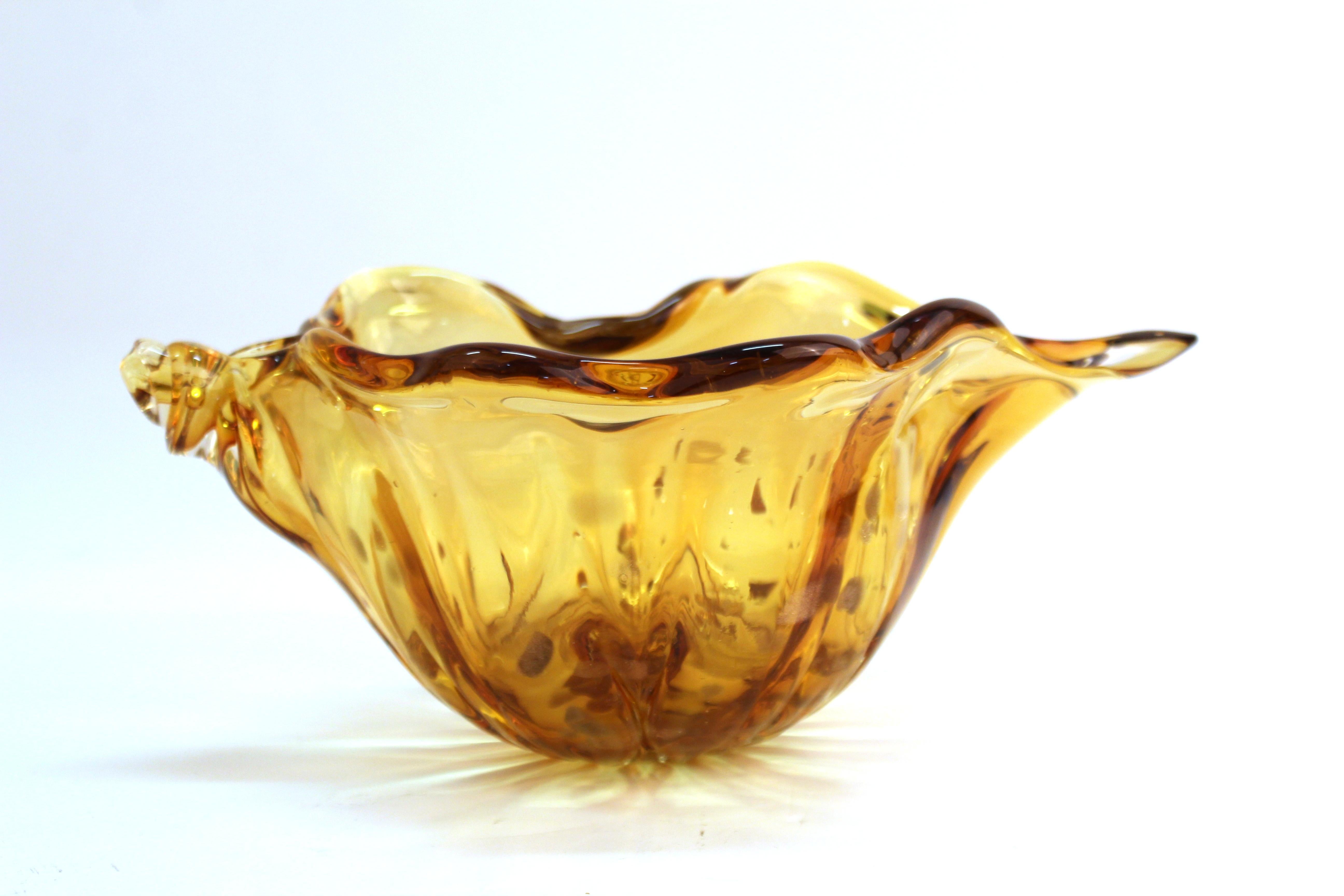 Italian modern Murano art glass vase in shape of a conch shell. The piece has gold inclusions. In great vintage condition with age-appropriate wear and use.