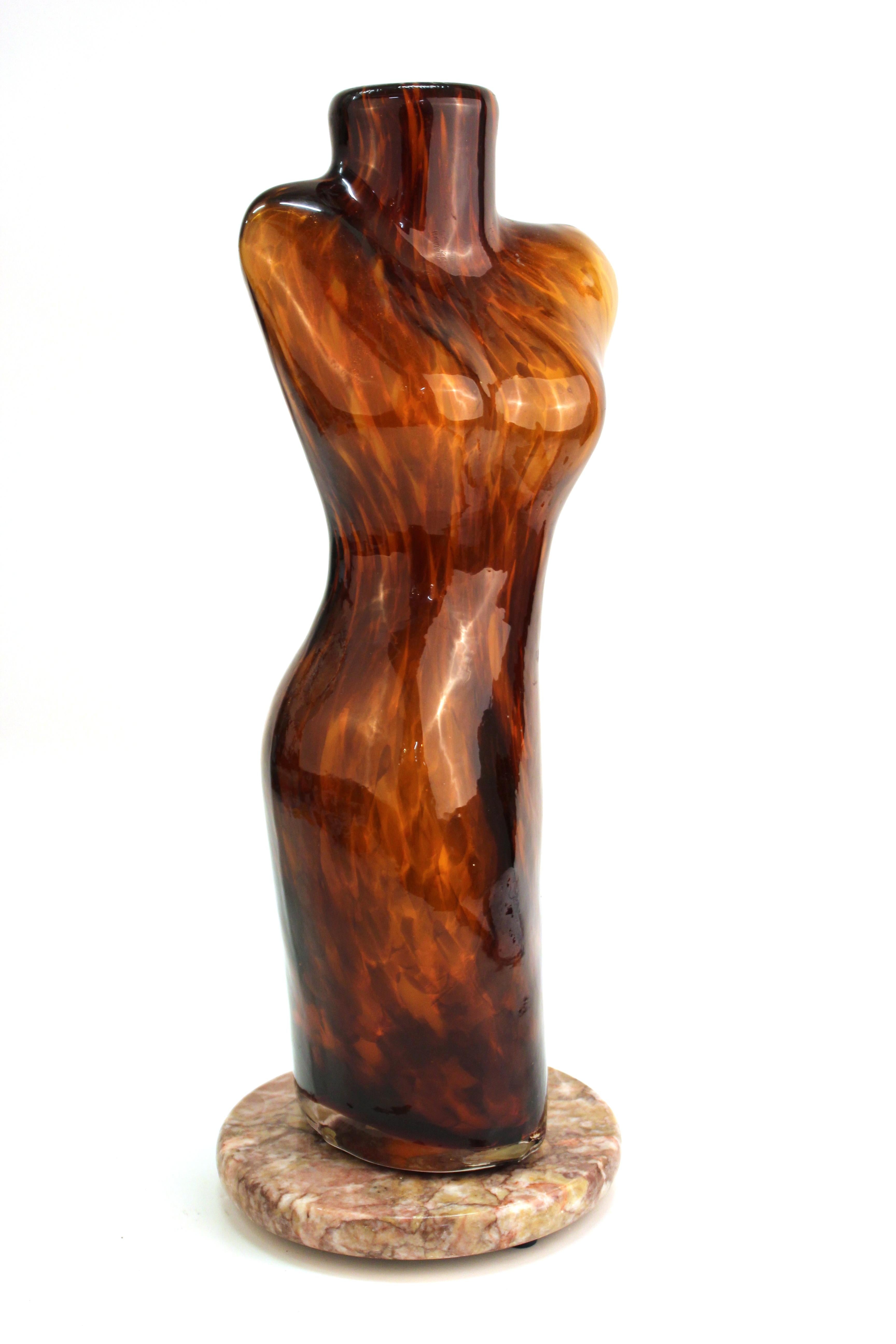 Italian modern Murano art glass sculptural vase in shape of a female torso. The piece was likely manufactured during the 1980s and has gold inclusions. Mounted atop a circular stone base, the piece is in great vintage condition with age-appropriate